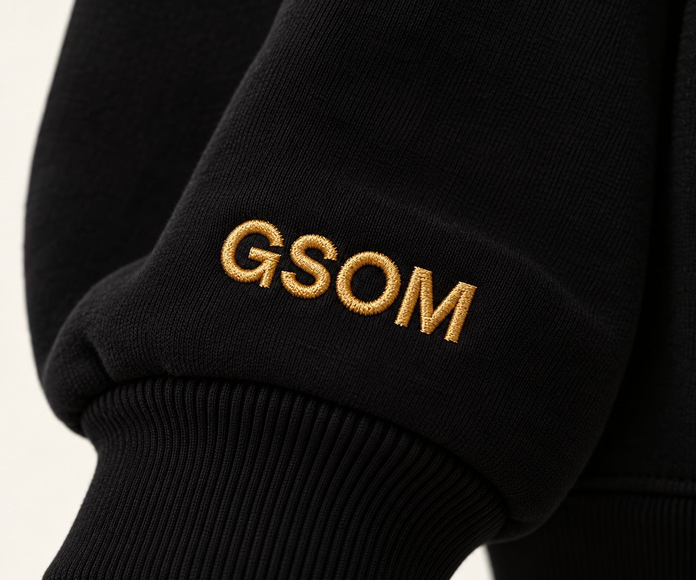 Gold GSOM Embroidery on Black Cuff.png