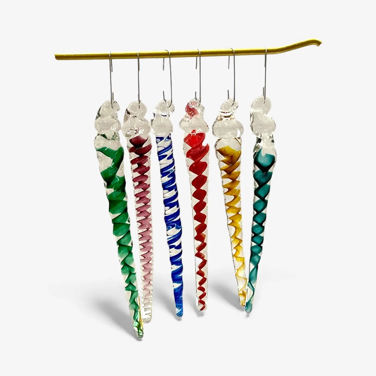 Six colorful twisted glass icicles hanging from a horizontal yellow stick against a white background.