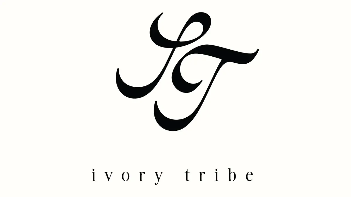 Stylized black initials 'I T' above the words 'ivory tribe' in lowercase letters on a white background.