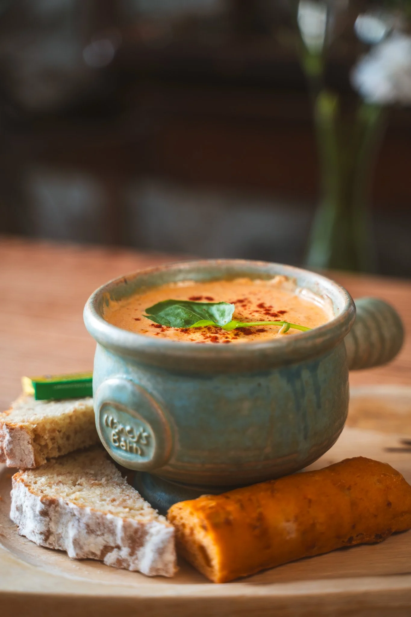 A bowl of seafood chowder, wheaten and chrizo bread