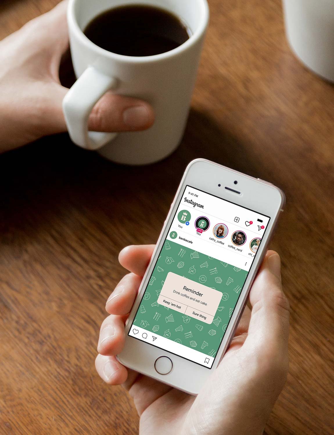 Person holding an iPhone displaying Instagram with a reminder notification, and another person holding a white coffee mug filled with black coffee.