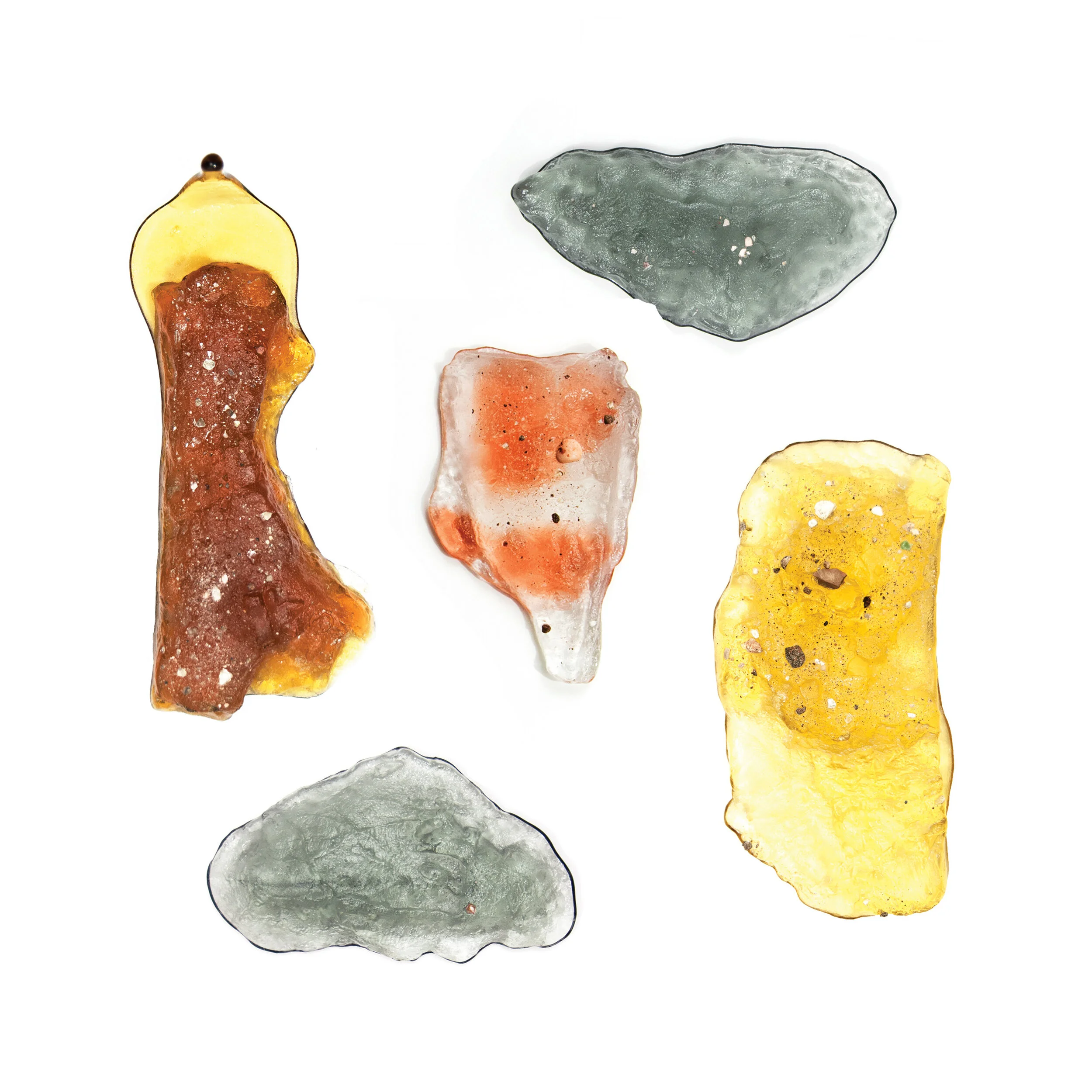 "Public Objects," 2013-14. A series commemorating the human wear and tear of an aging city. Glass castings of New York City potholes, clockwise from top left: "Edge of a Manhole," "Intersection," "Manhattan End of the Brooklyn Bridge," "Sidewalk," an