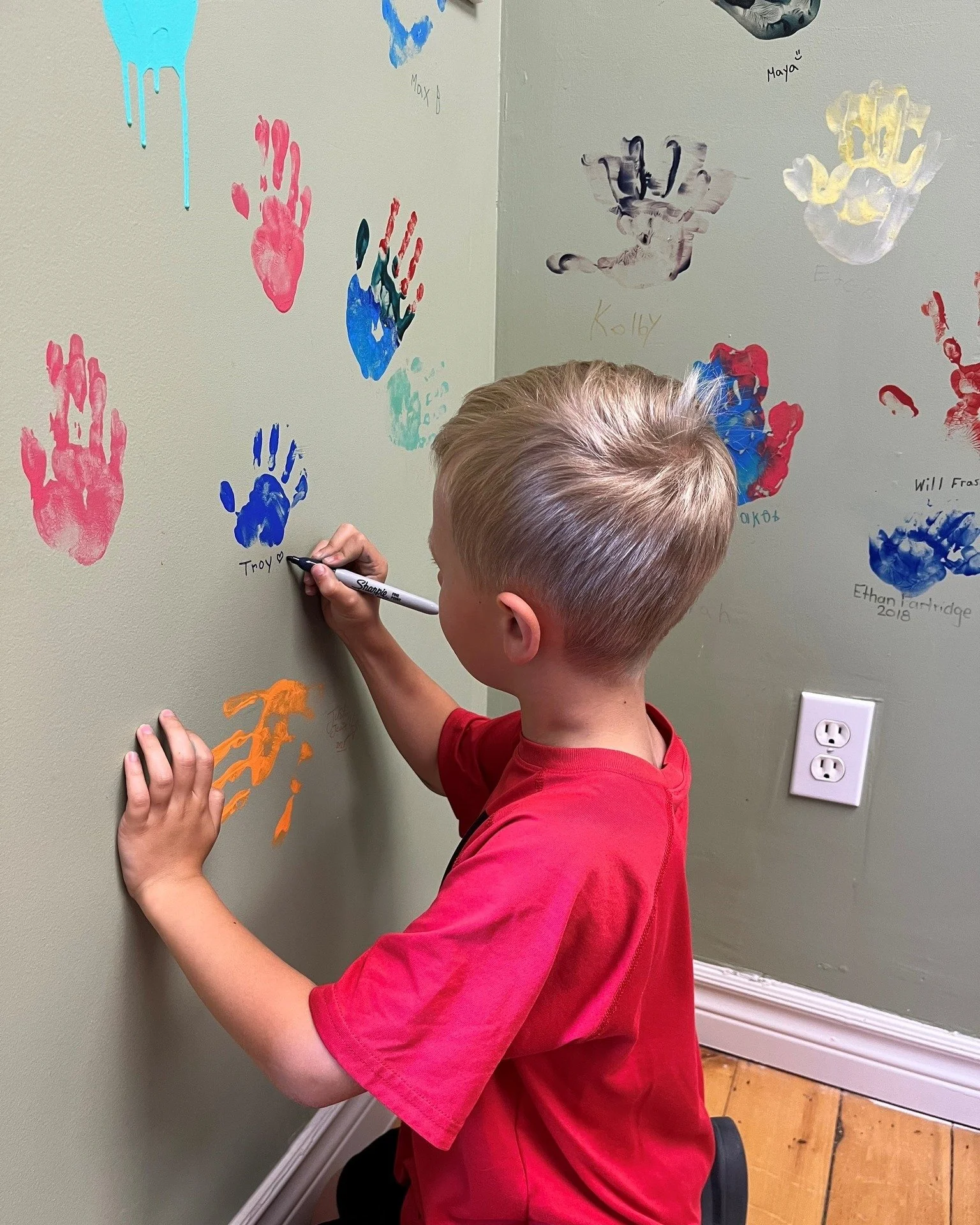 We had a special visitor today! Troy stopped by our office to find his handprint and see if he'd grown... he has! Troy added his name and a smiley face as now he only has to go for &quot;a poke&quot; once a year! Thanks for stopping by Troy! 💛🎗💛