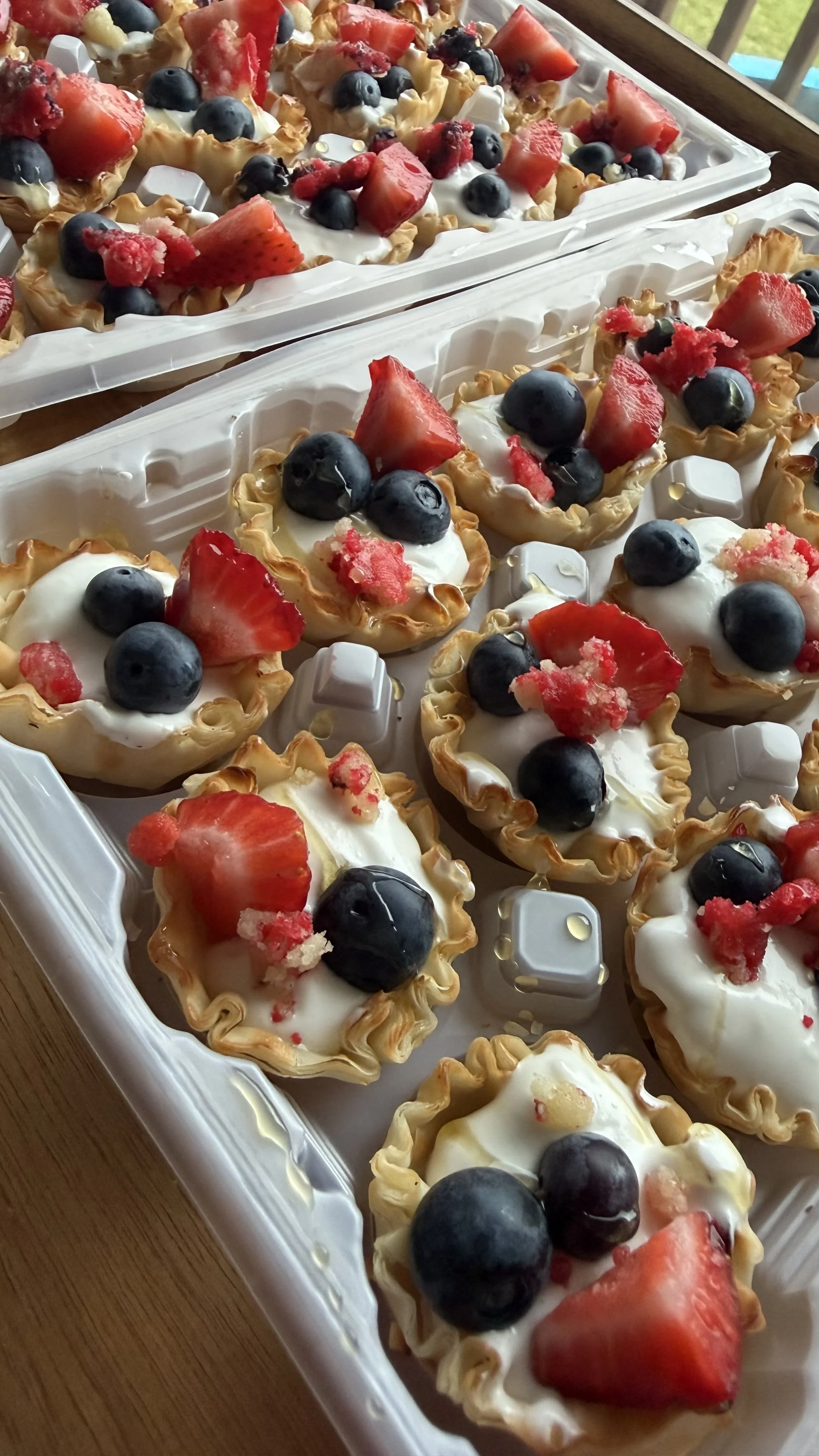 Easy dairy free festive fruit cups with strawberries, blueberries, honey, and a creamy cheesecake filling.