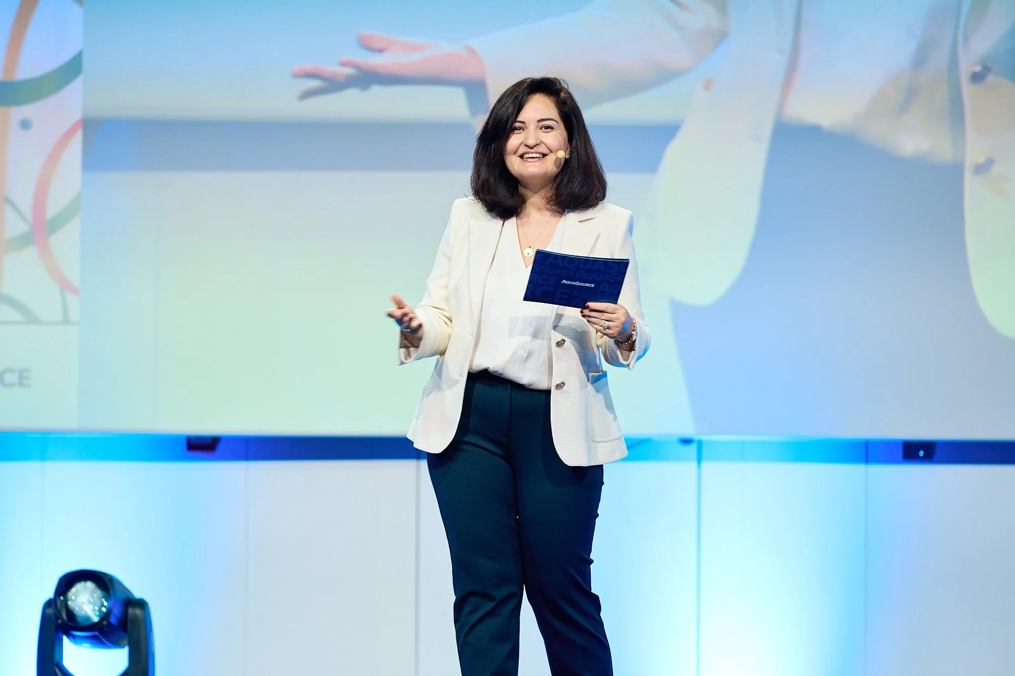 live-event-speaker-on-stage-presenting-happy-smiling.jpg