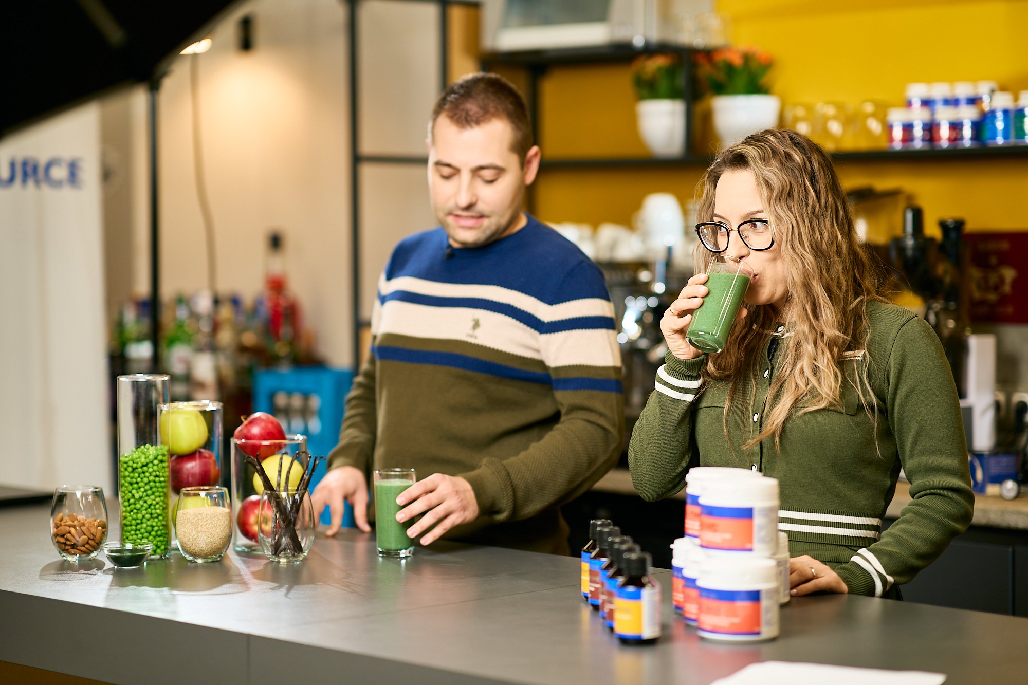 behind-the-scenes-filming-wellness-brand-kitchen-woman-drinking-healthy-green-smoothie.jpg