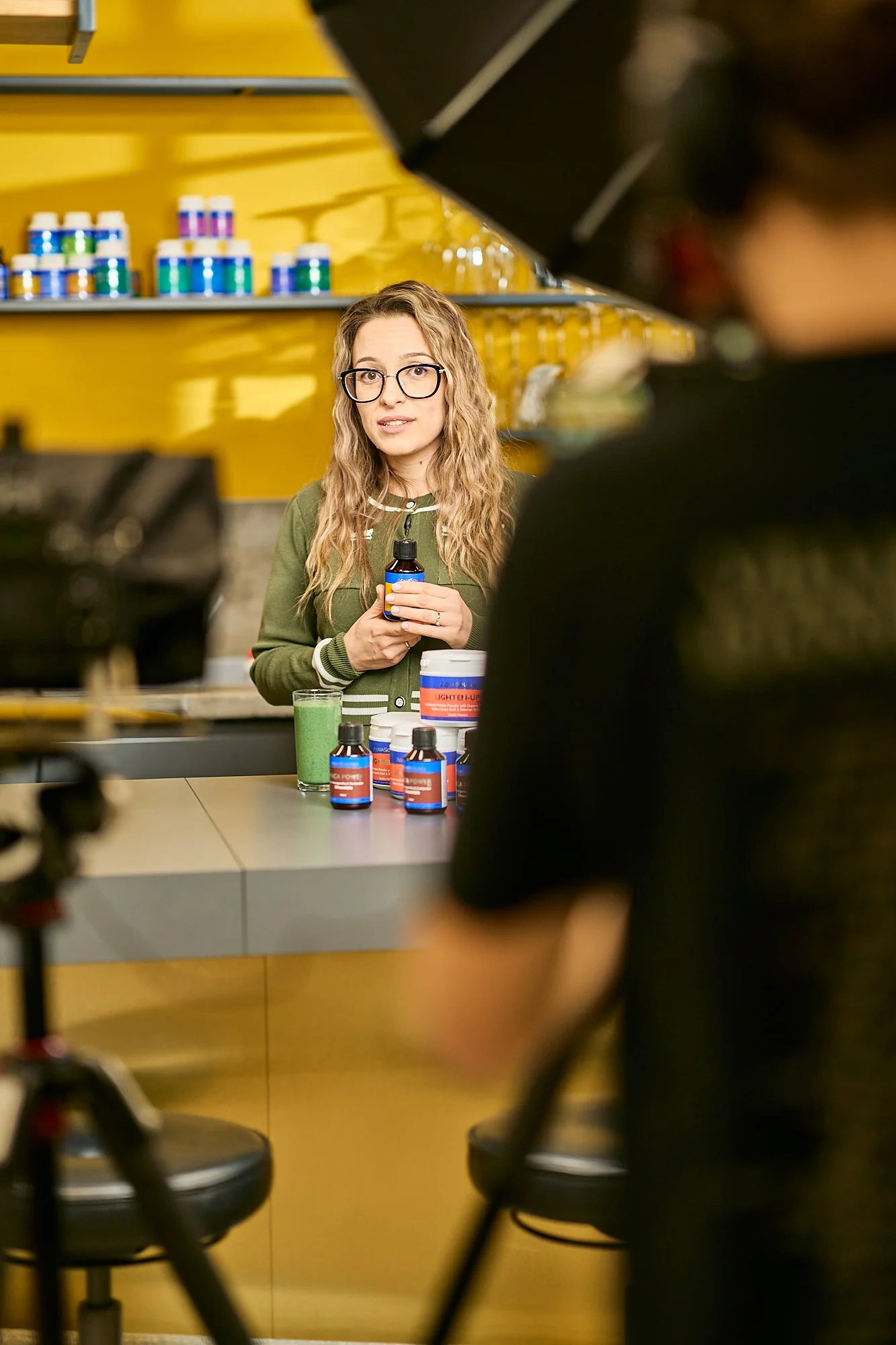 behind-the-scenes-filming-wellness-brand-kitchen-woman-presenting.jpg