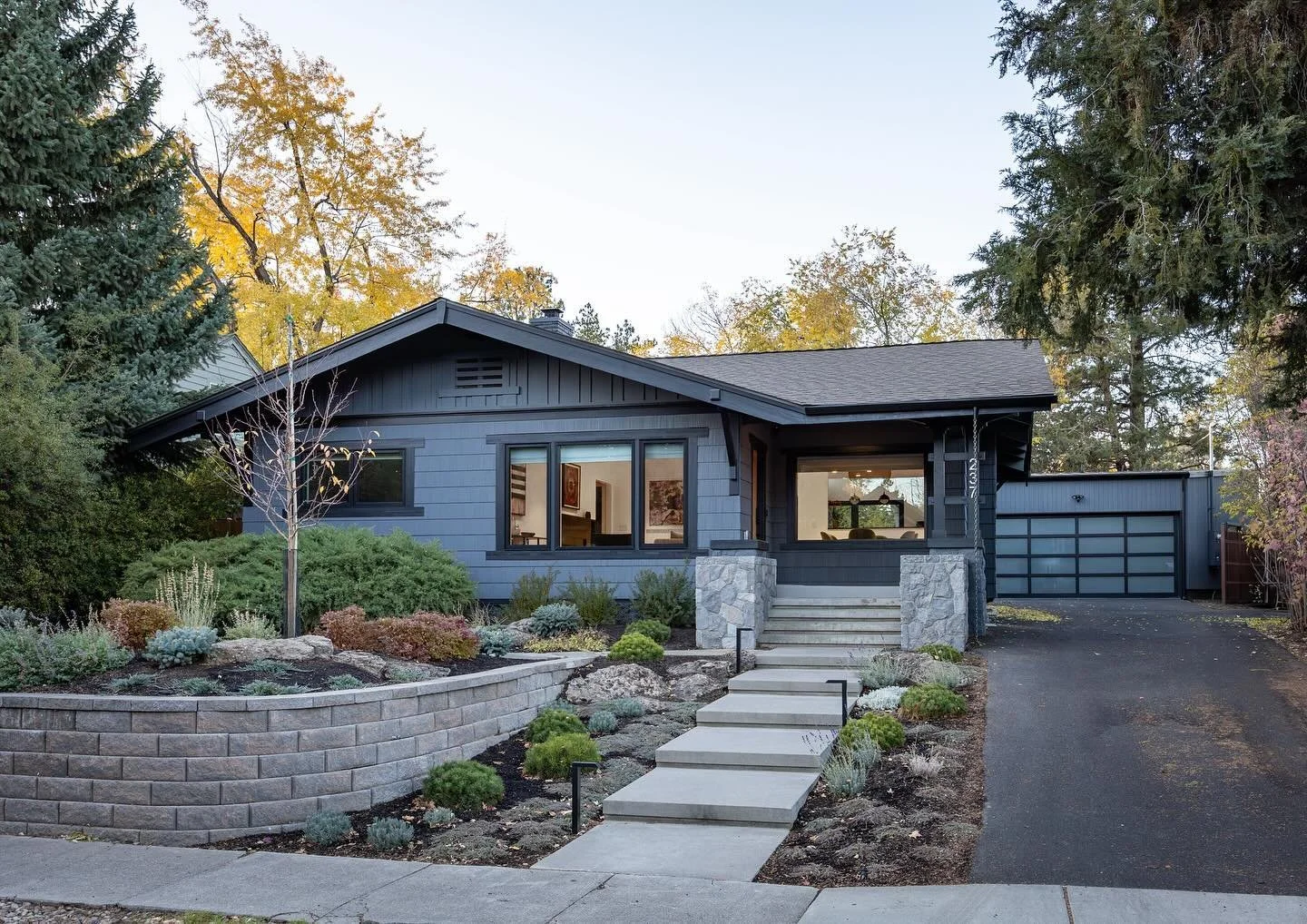 Front entry at our recently completed project in downtown Bend. Swipe to see before photo. 

The owners goals were to update their charming hundred year old craftsman house, add a modern kitchen, family room, primary suite, and to create a warm invit