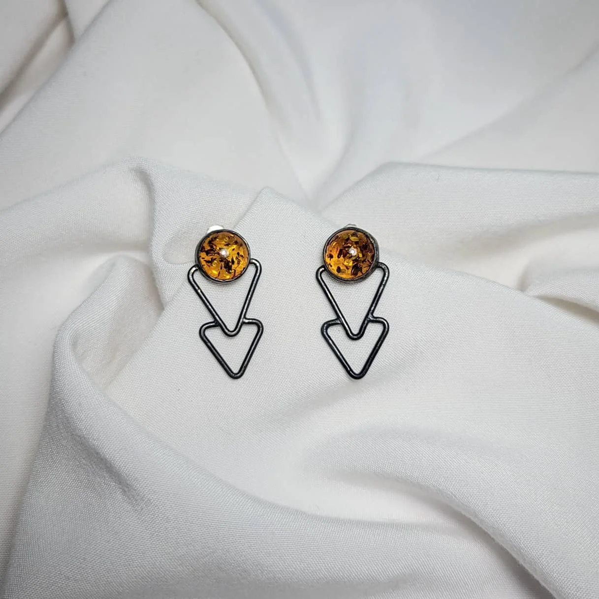 Copper with sterling silver posts. $120.