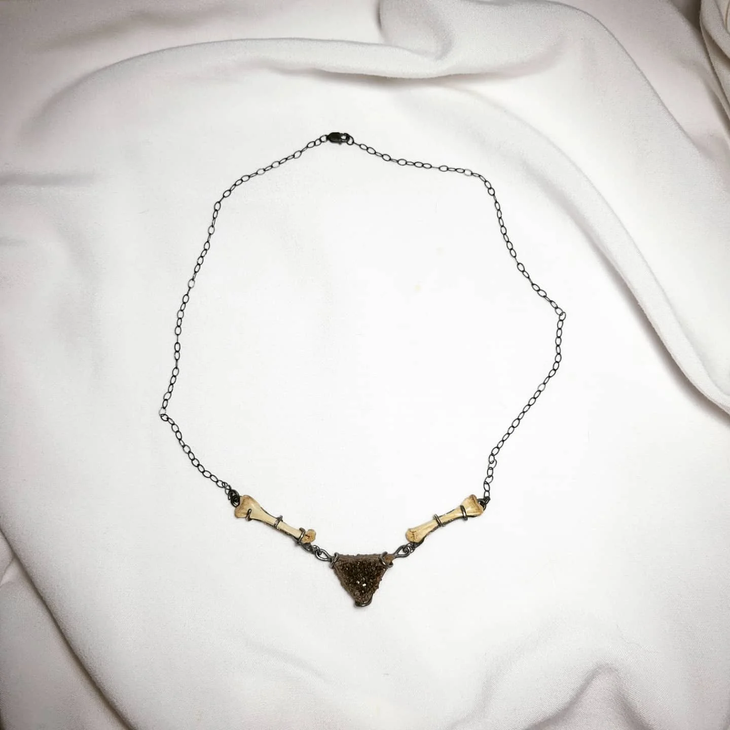Druzy, squirrel bones, sterling silver. $230.