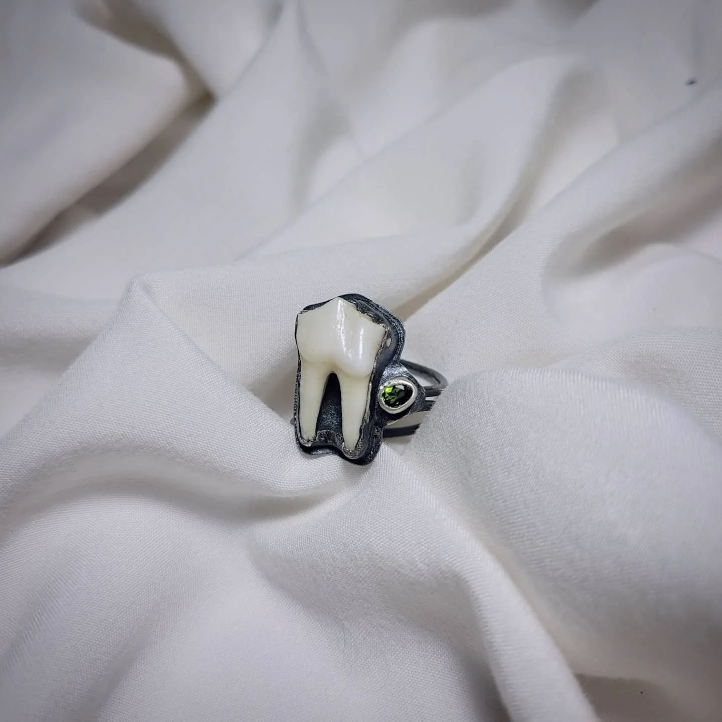 Animal tooth, green tourmaline, sterling silver. Size 10. $200