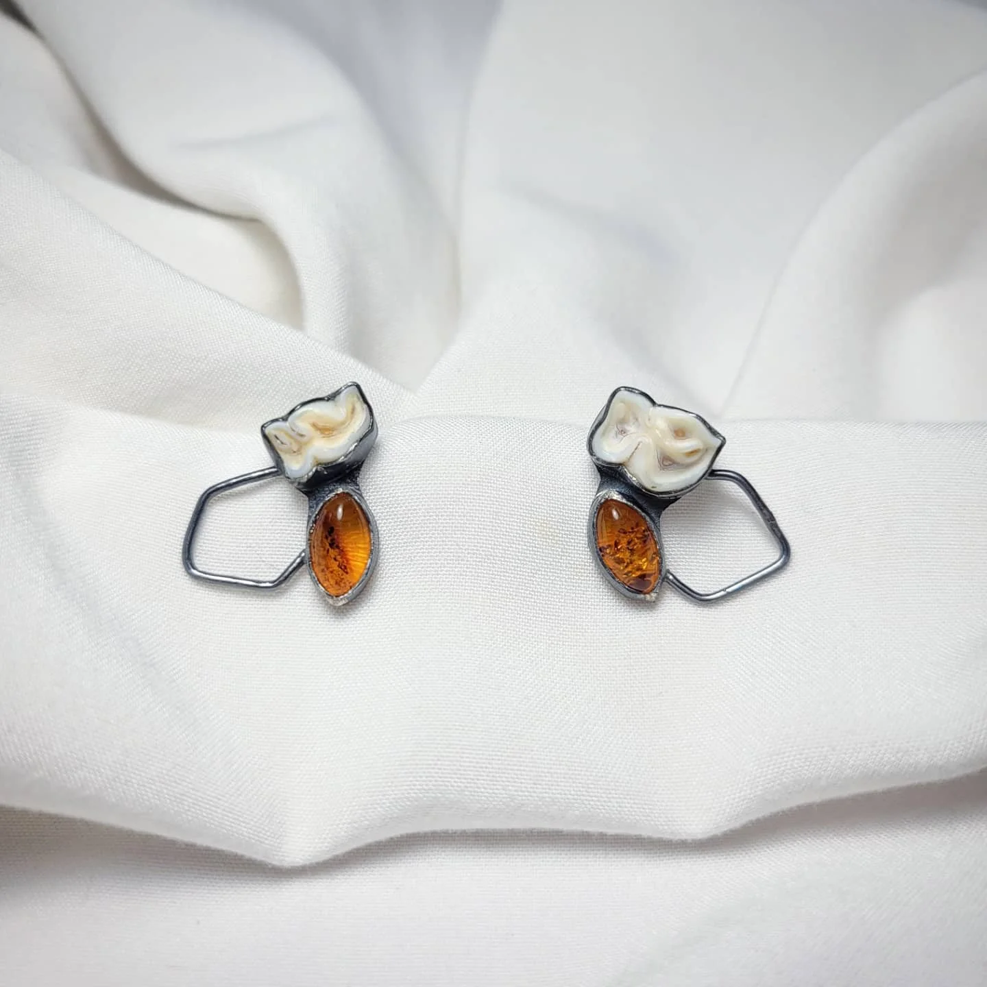 Baltic Amber, animal teeth, sterling silver. $180. SOLD.