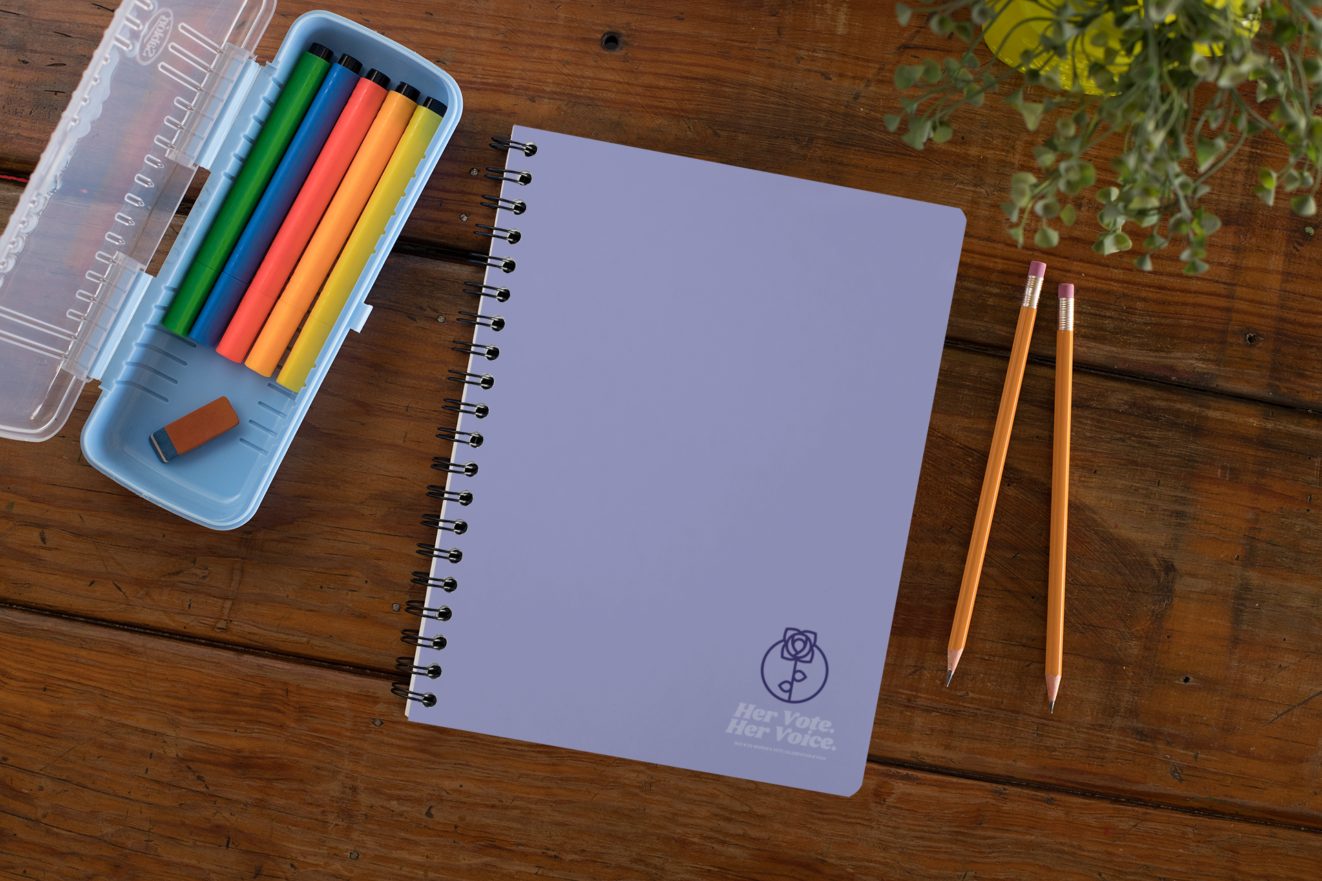 mockup-of-a-spiral-notebook-over-a-wooden-surface-29960.png