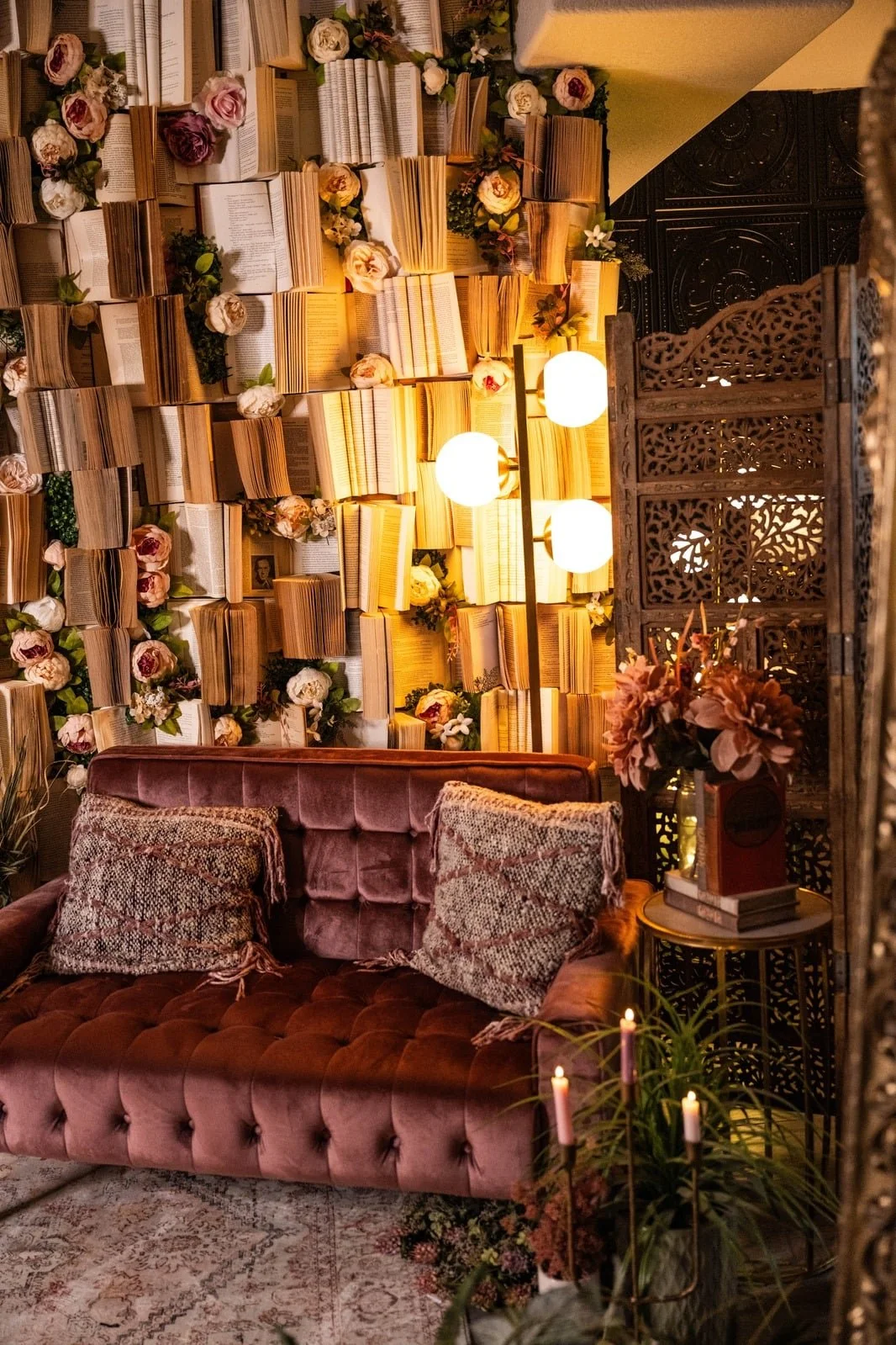 Pink tufted settee and floral book wall set in our private boudoir studio near Fort Collins