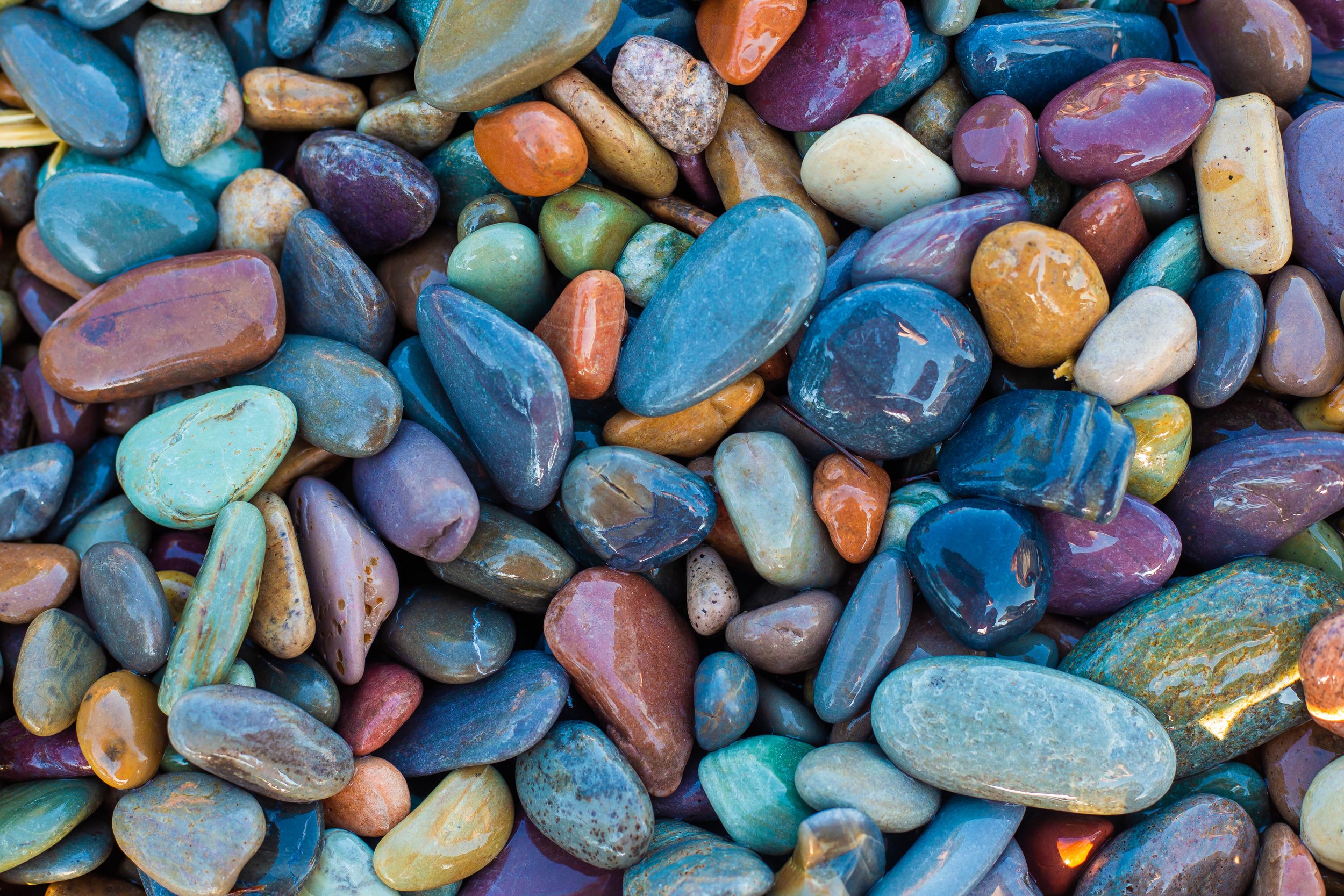 Colorful polished stones of various shapes and sizes.