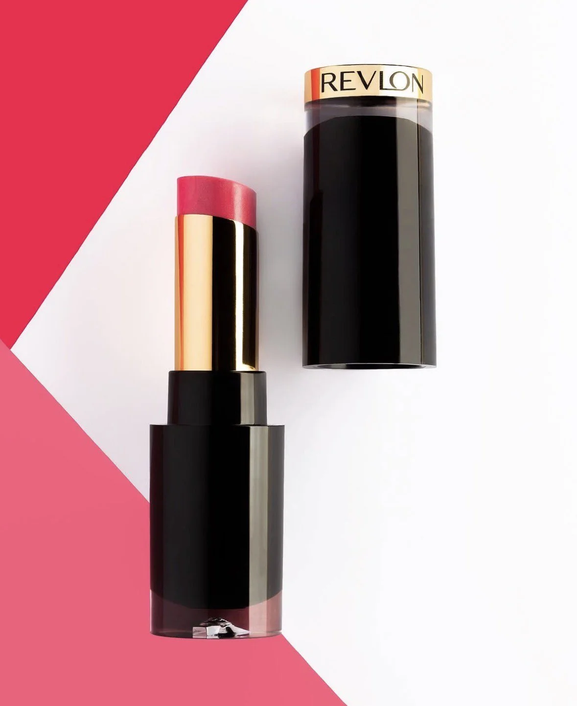 A pink lipstick with a gold capsule in a black and pink tube and a black and gold lipstick case with a gold band labeled 'Revlon'.