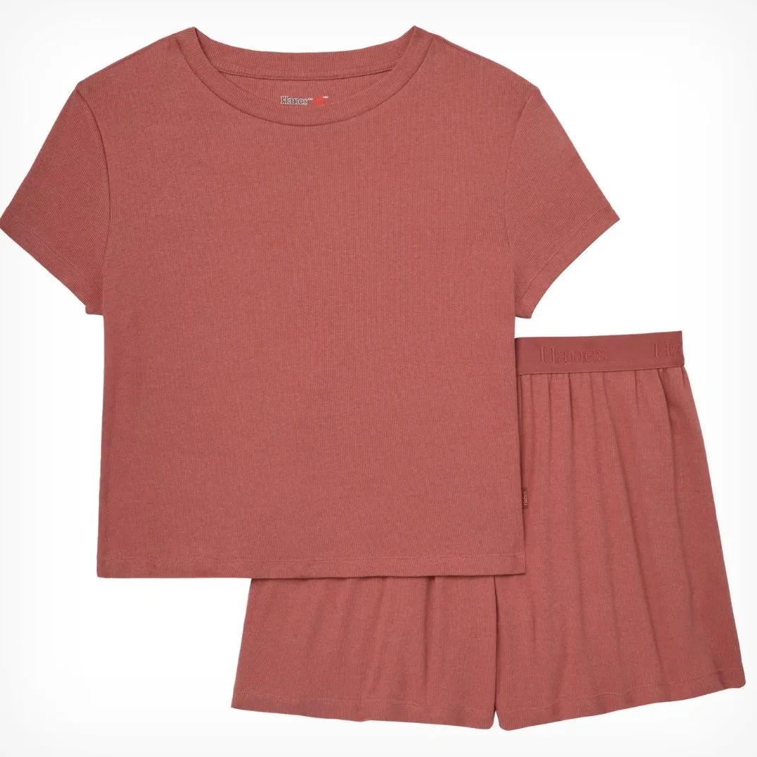 A matching set of a pinkish-red t-shirt and shorts, both made of a textured fabric, designed for casual wear.