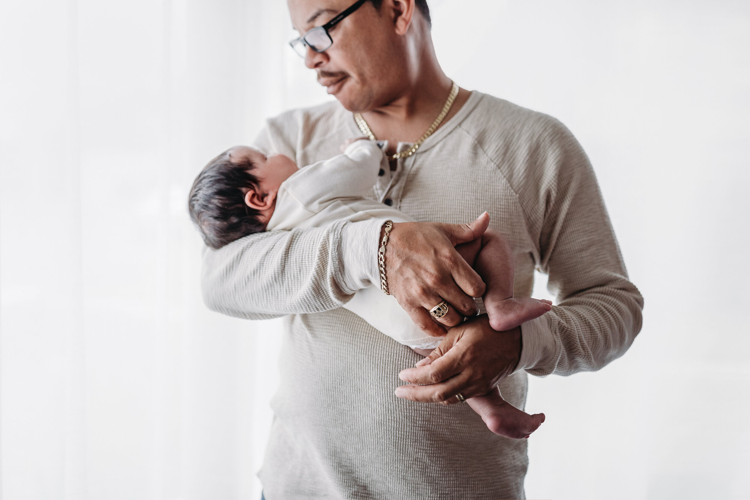 Dad and son - Lifestyle Newborn Photos in  clients Home with Baby Boy and family photo and outfit ideas
