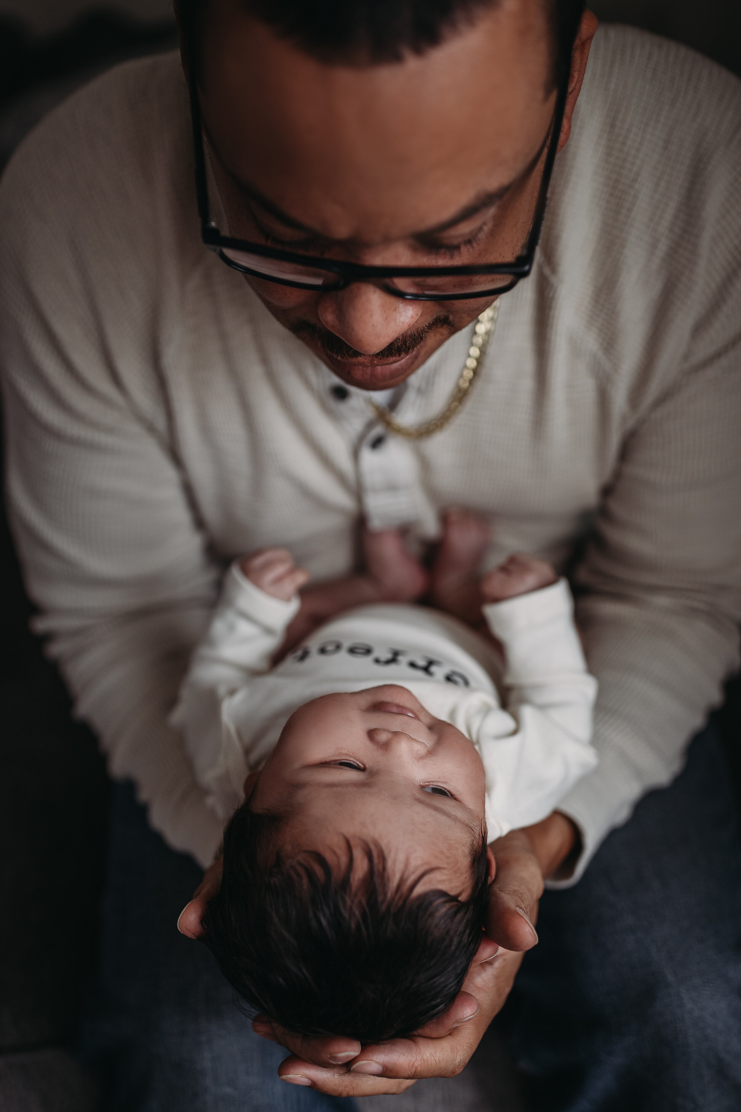Dad and baby boy - Lifestyle Newborn Photos in  clients Home with Baby Boy and family photo and outfit ideas