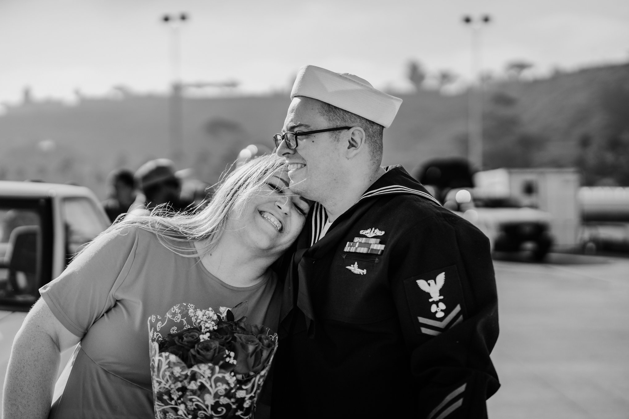 Black and white photo of couple at military Homecoming