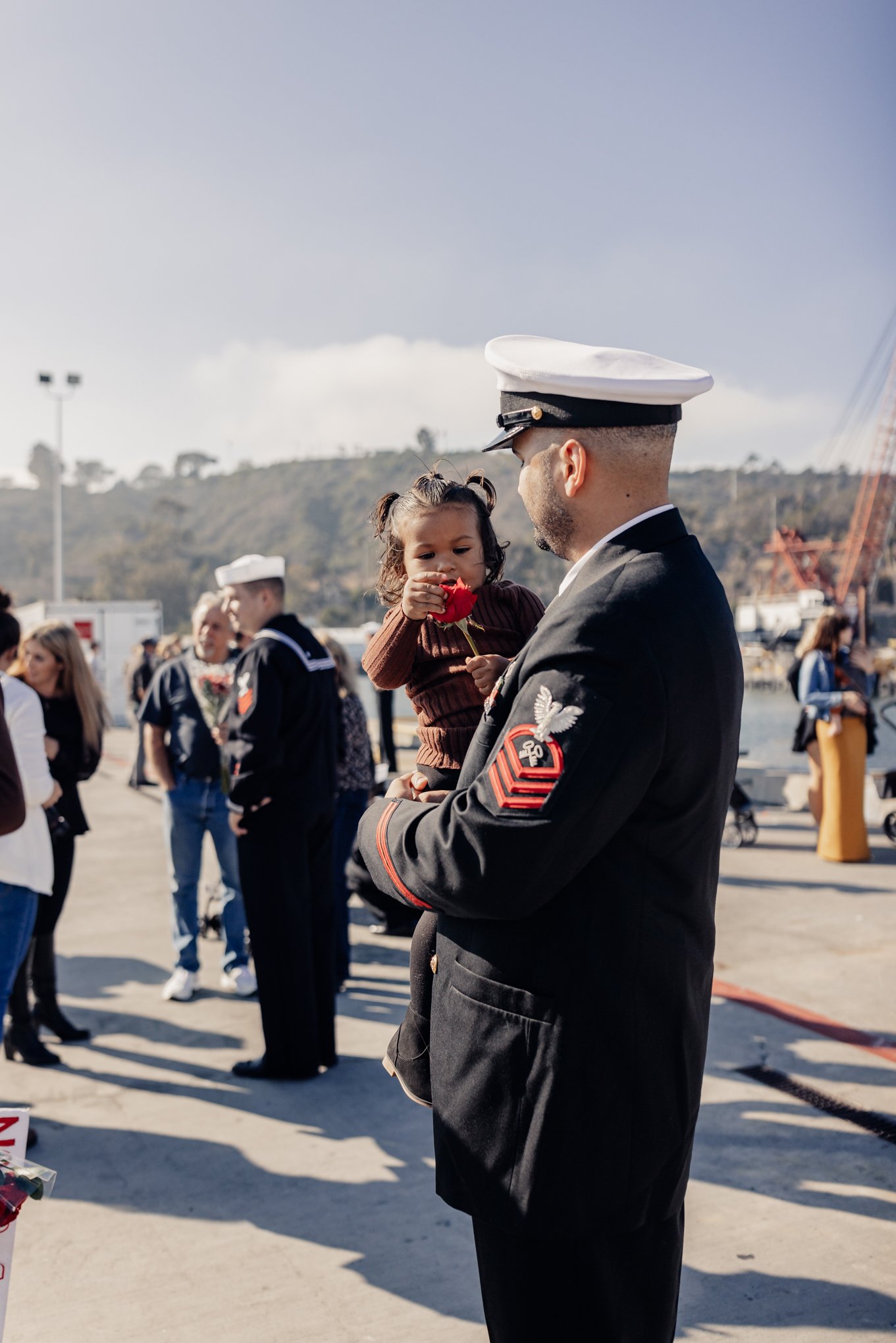 First Class Petty Officer holding daughter after long deployment on submarine 