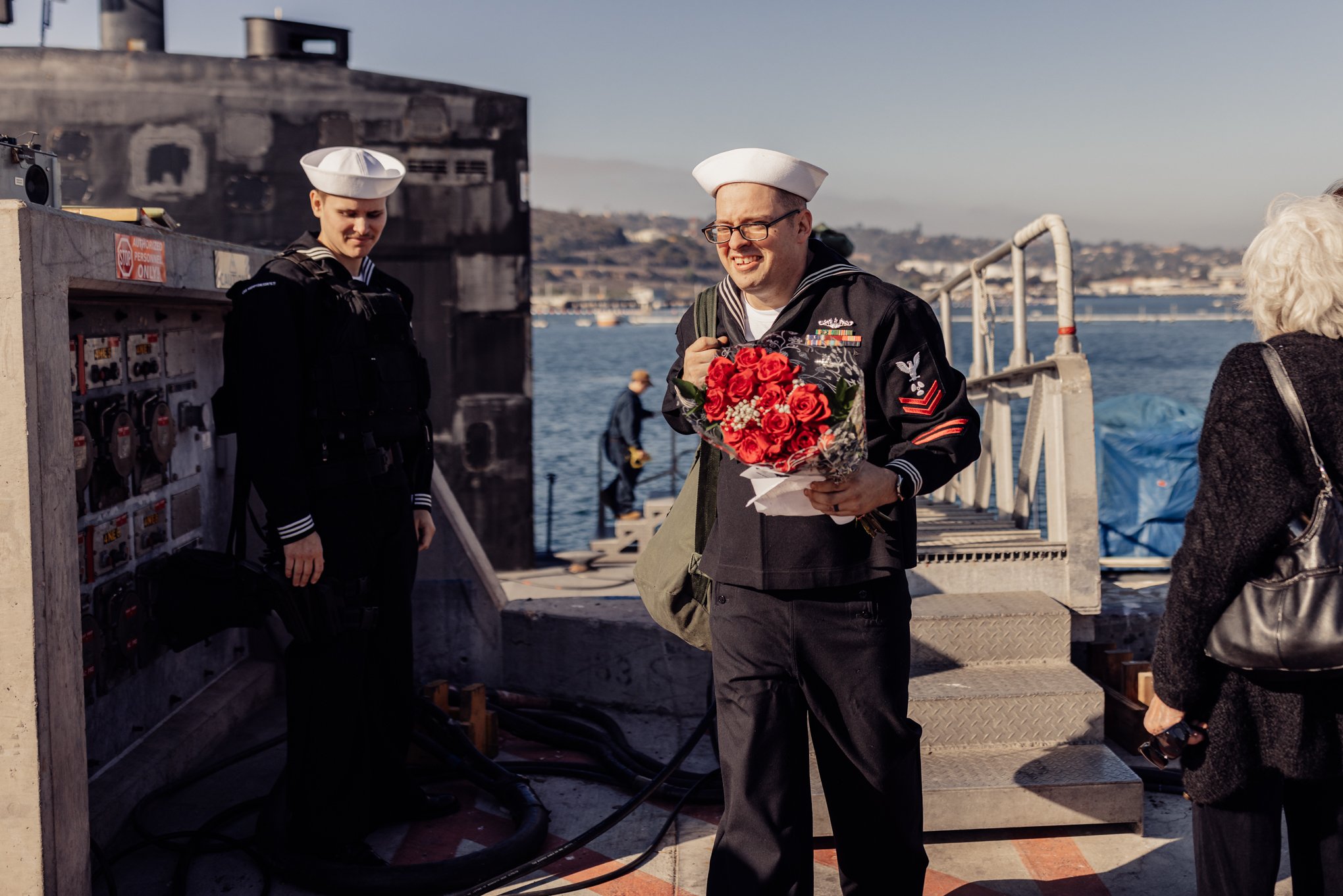 Smiling sailor at military Homecoming in point loma California 