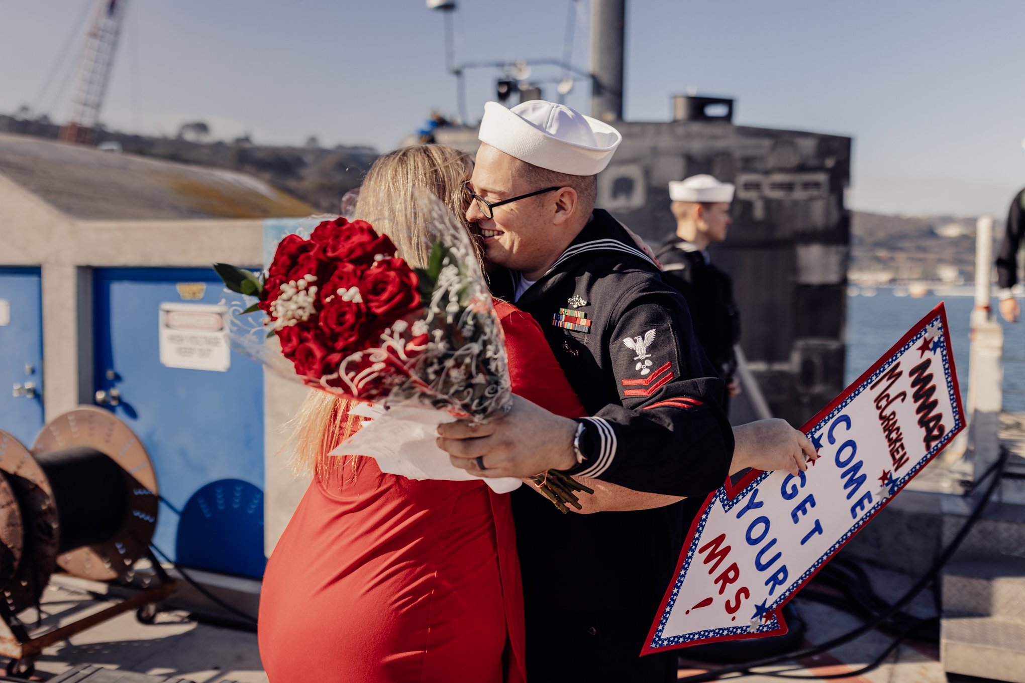 First hug after months at sea, husband and wife embracing at Homecoming 