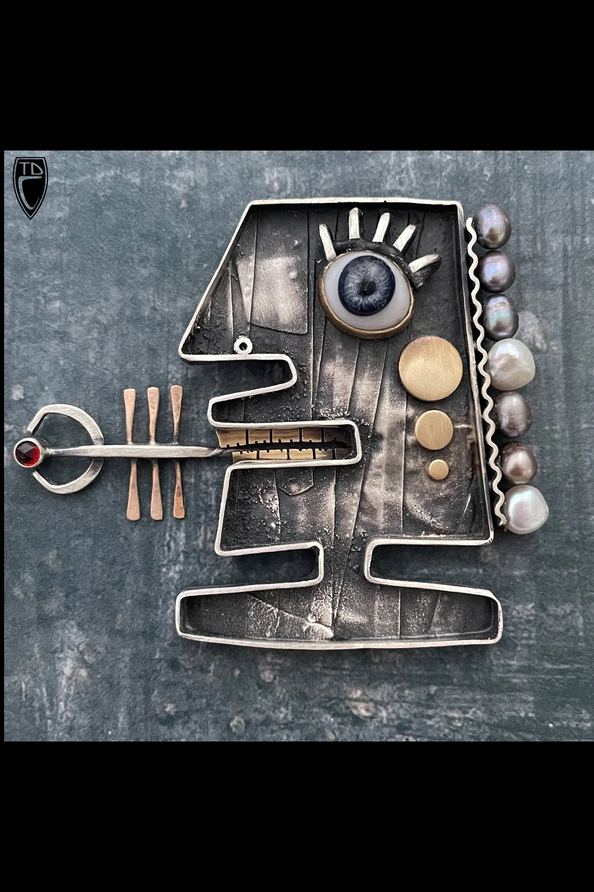 "Put That in Your Pipe and Smoke it", Sterling Silver, Brass, Bronze, Vintage Paperweight Glass Eye, Garnet, Pearl and Steel Brooch