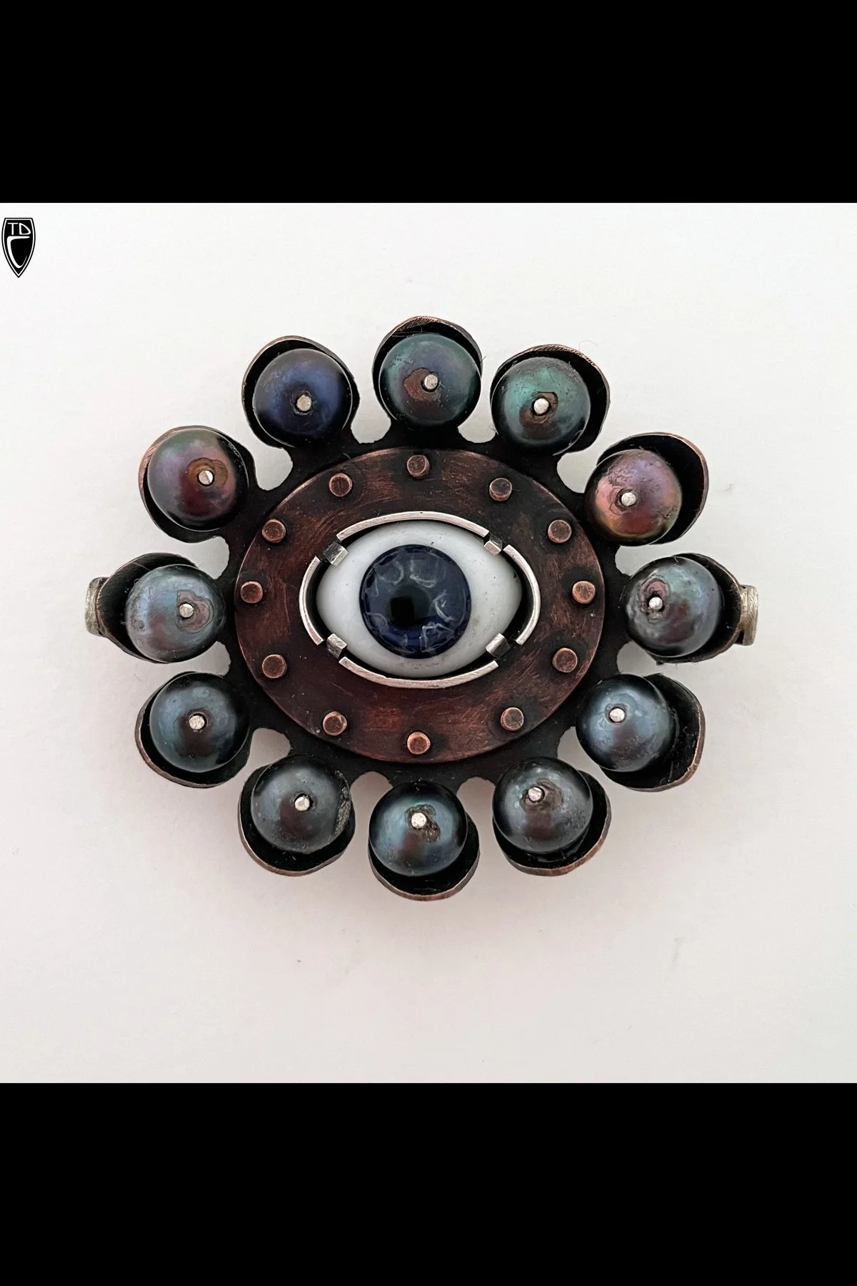 "An Occasion to Visit My Roots", Copper, Sterling Silver, Antique Glass Doll's Eye, Black Pearl and Steel