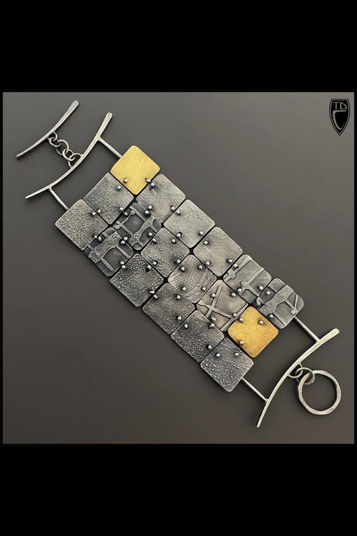 Sterling Silver and Brass Textural "Patchwork" Square, Fluid Toggle Bracelet