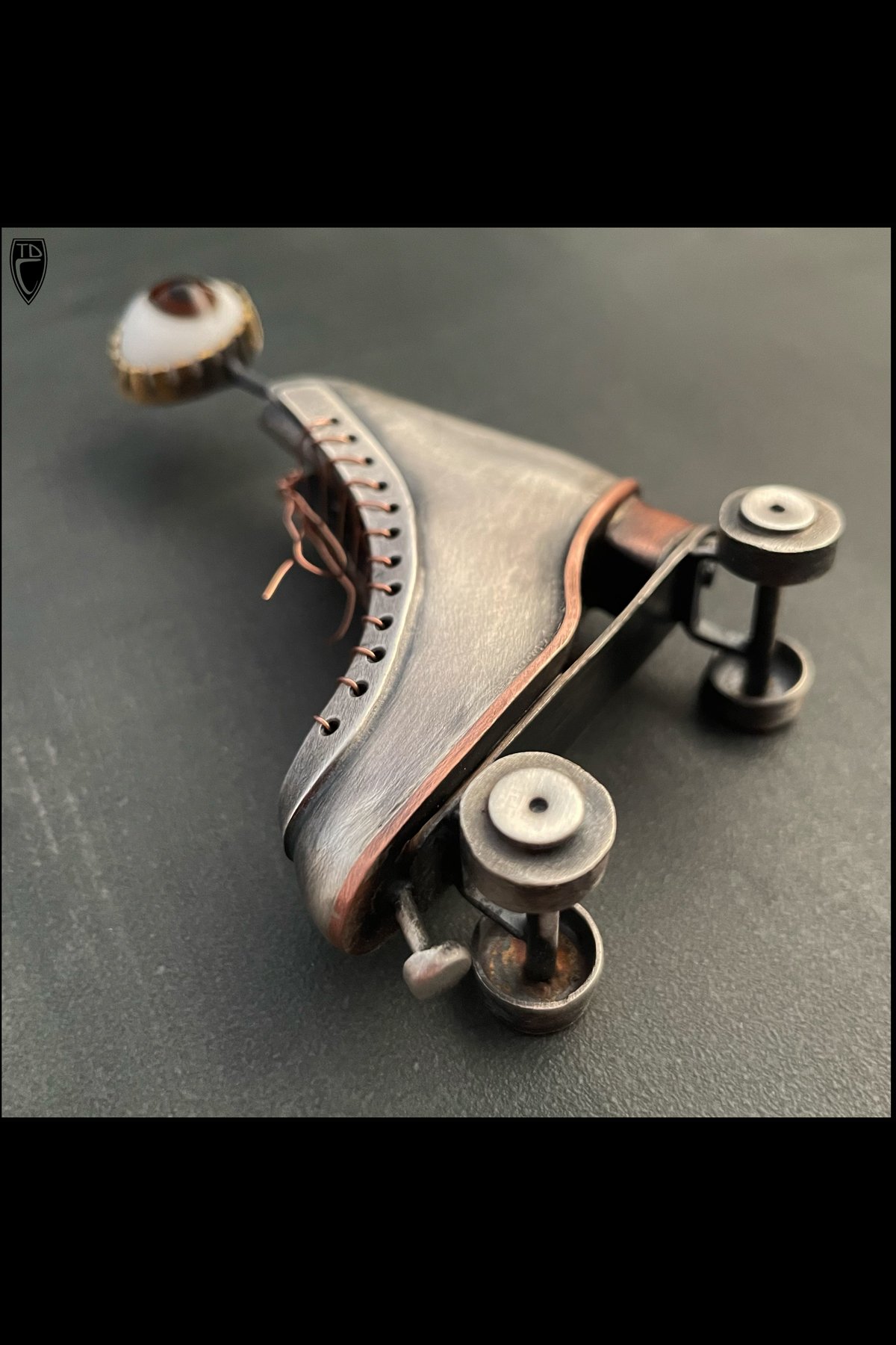 "Eye Roll", Sterling Silver, Copper, Brass and Antique Glass Doll's Eye Roller Skate Brooch/Pendant/Sculpture