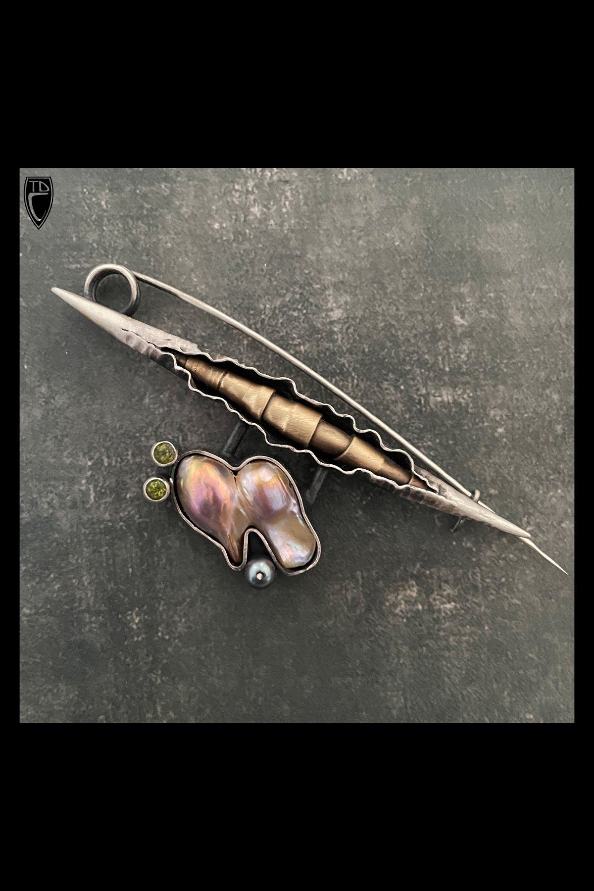 "Emergence", Sterling Silver, Brass, Peridot and Pearl Fibula Brooch