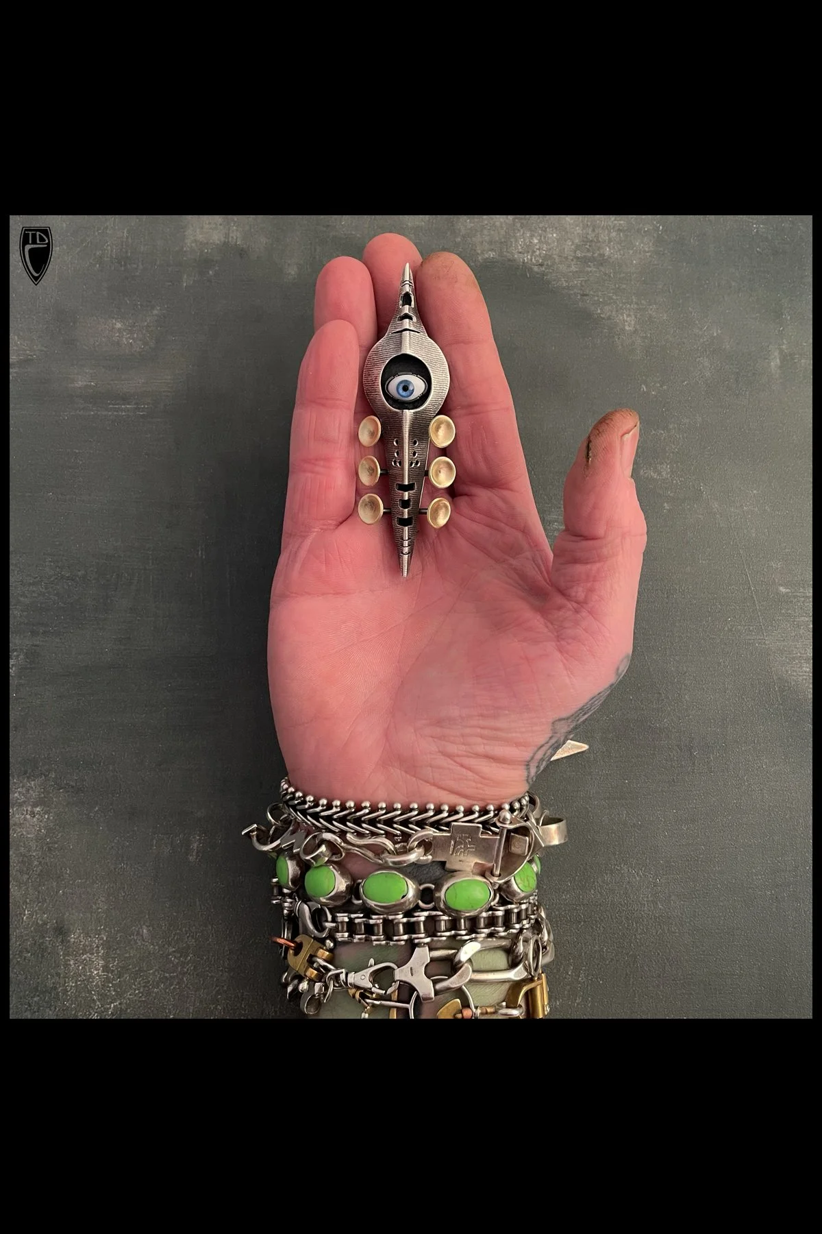 "Eye Spy", Fold formed and Hollow Formed Textural Sterling Silver, Brass and Antique Glass Doll's Eye Brooch/Pendant