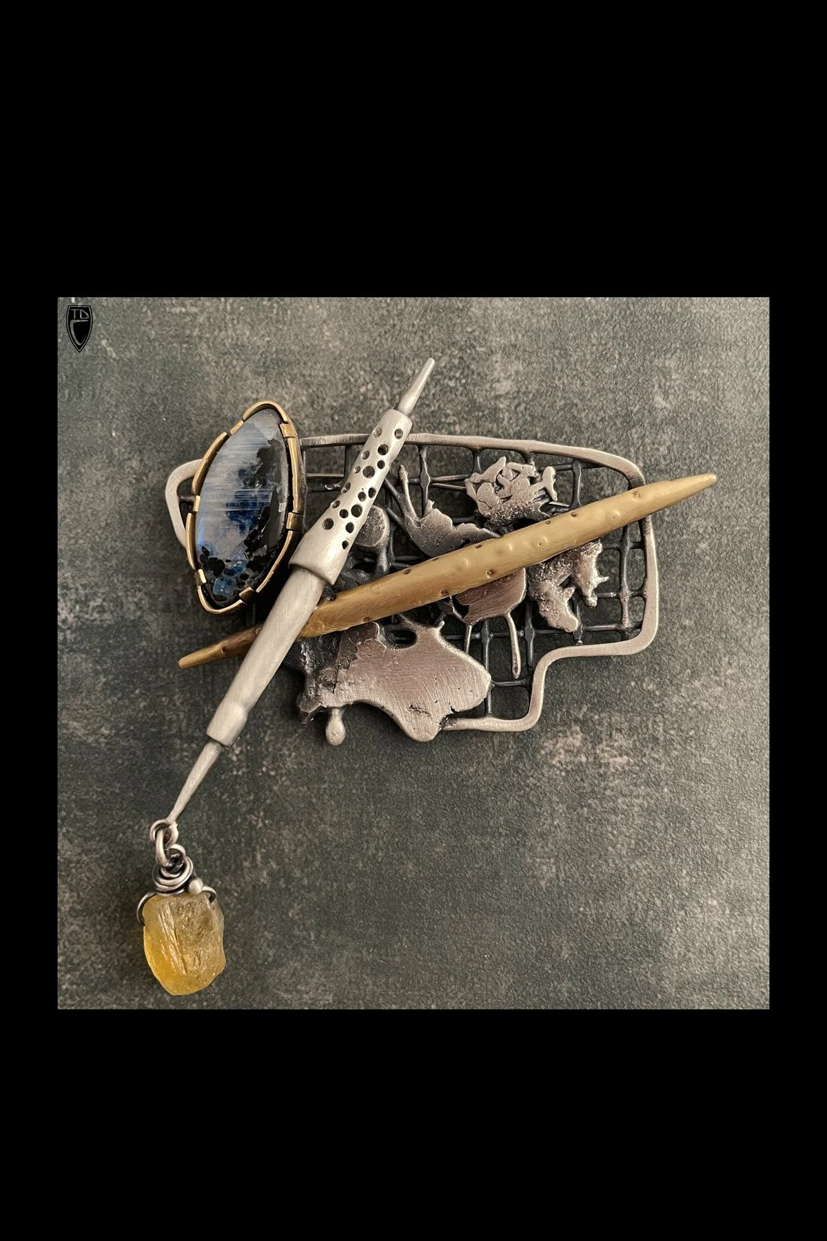 "Conflictive", Sterling Silver, Brass, Moonstone with Tourmaline Inclusions, Citrine and Steel Brooch