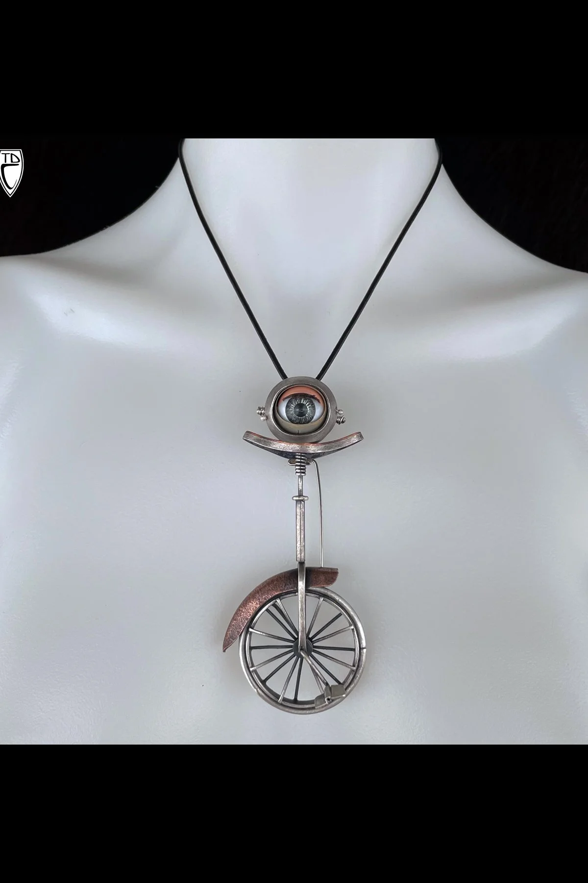 "Un-ī (eye)-Cycle", Sterling Silver, Copper, Vintage Doll Sleepy Eye Kinetic Unicycle Brooch Pendant