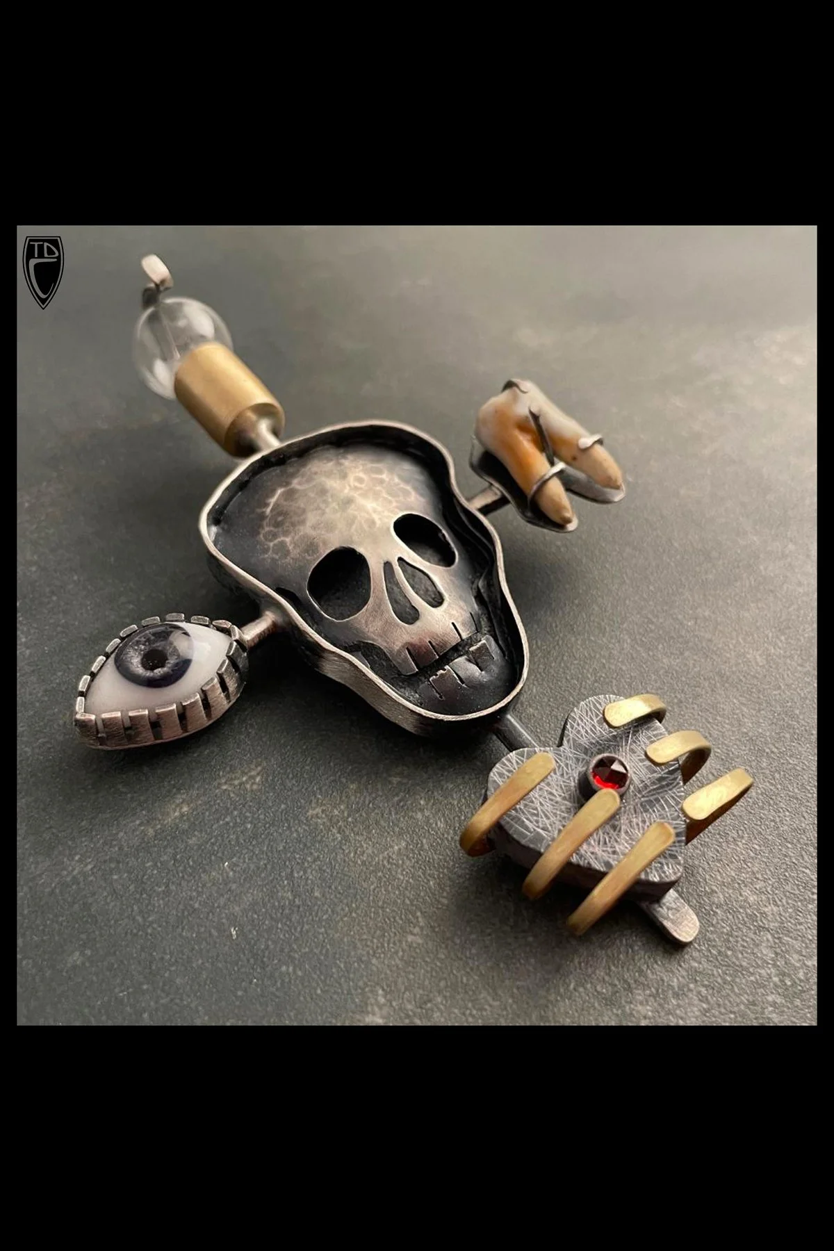 "Reliquary", Sterling Silver, Brass, Vintage Doll Eye, Ceramic Tooth, Vintage Light Bulb and Garnet Brooch/Pendant