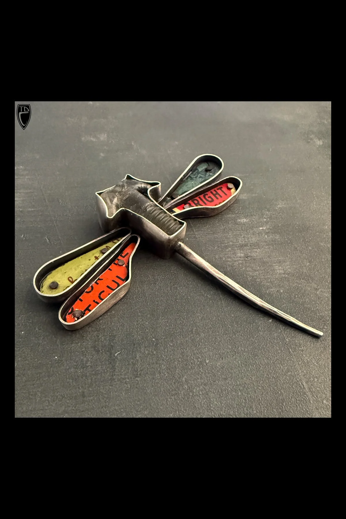 "Torque", Sterling Silver, Copper, Antique Cast Glass Bolt and Antique Tin Lithography Dragonfly Brooch