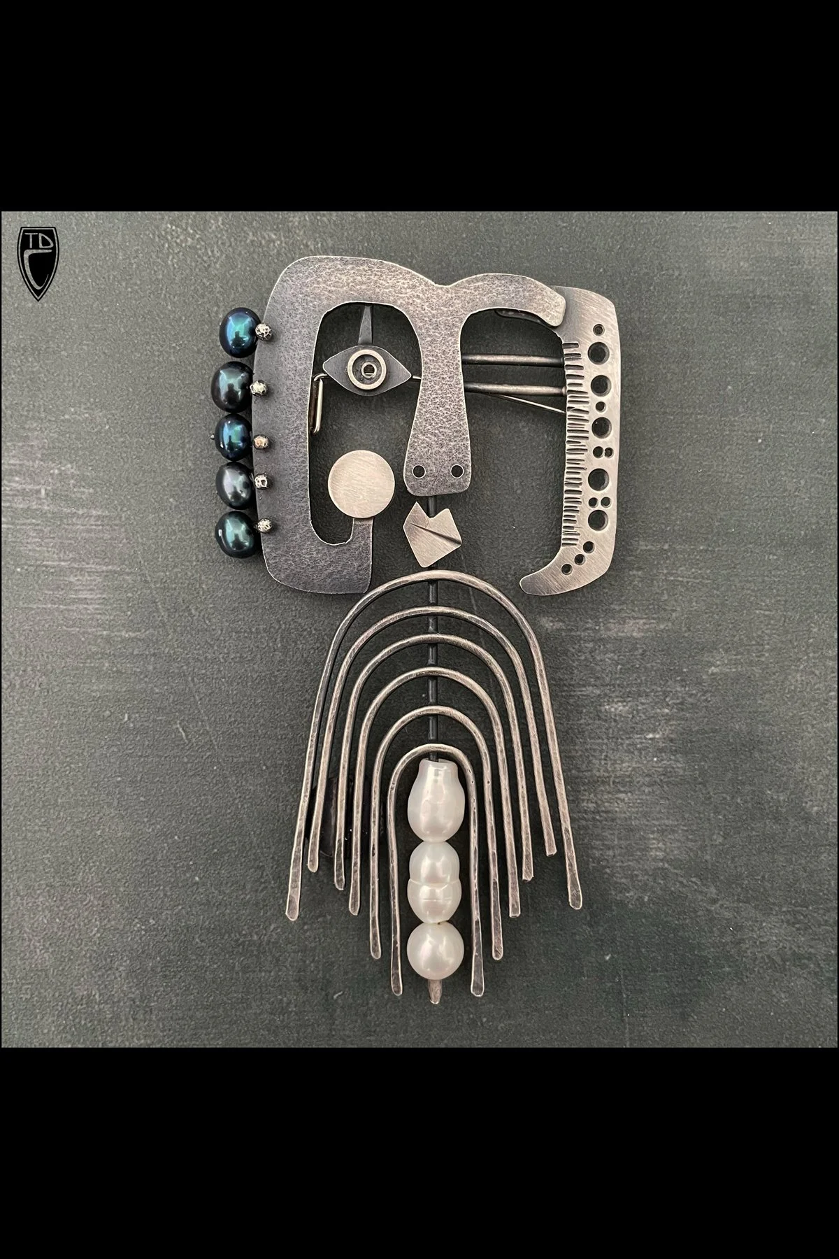 "About Face", Sterling Silver and Pearl Brooch/Pendant