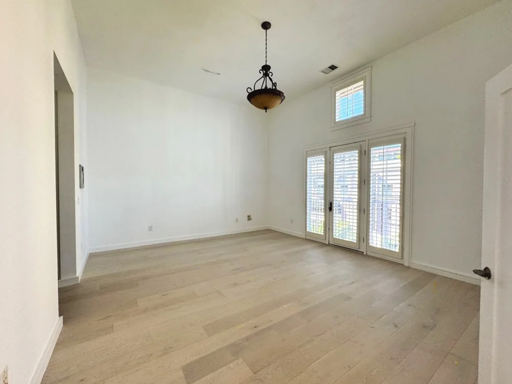 Bedroom with vaulted ceiling at Santana Row, San Jose before staging