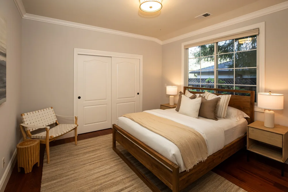 Bedroom with garden view at Benvenue Avenue, Los Altos after staging by Encore