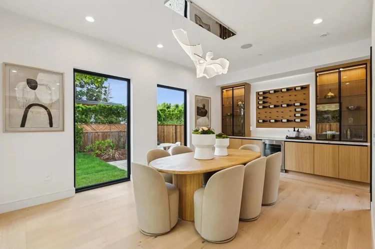 Dining area and wine wall at 743 Edge Lane, Los Altos
