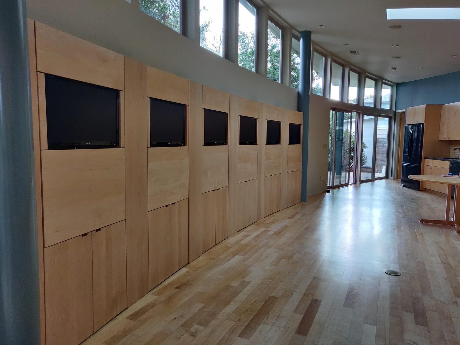 Living room and monitor wall at 475 Fernando Avenue, Palo Alto before staging