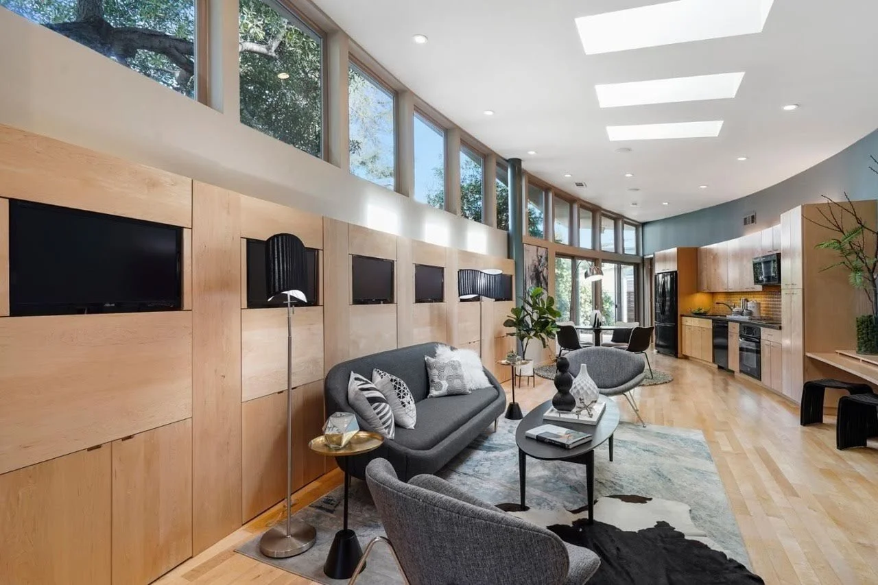 Living room and monitor wall at 475 Fernando Avenue, Palo Alto after staging by Encore