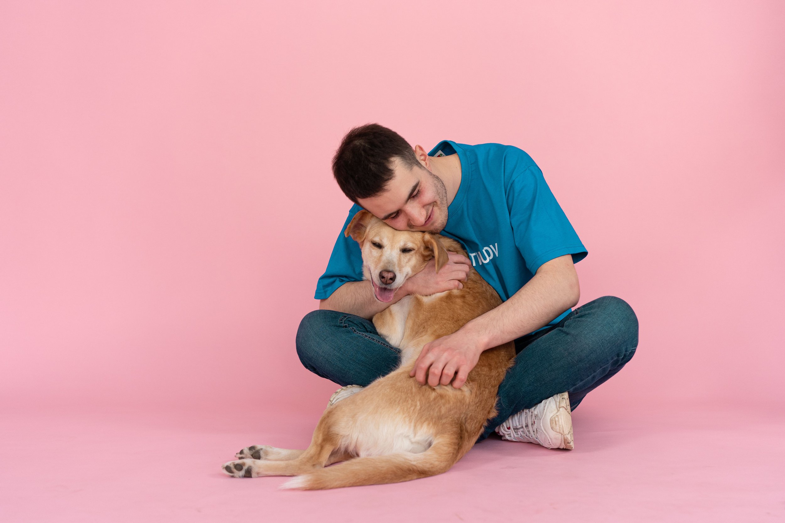Golden Retriever with owner before advanced cancer screening and diagnostic imaging near Houston, Texas