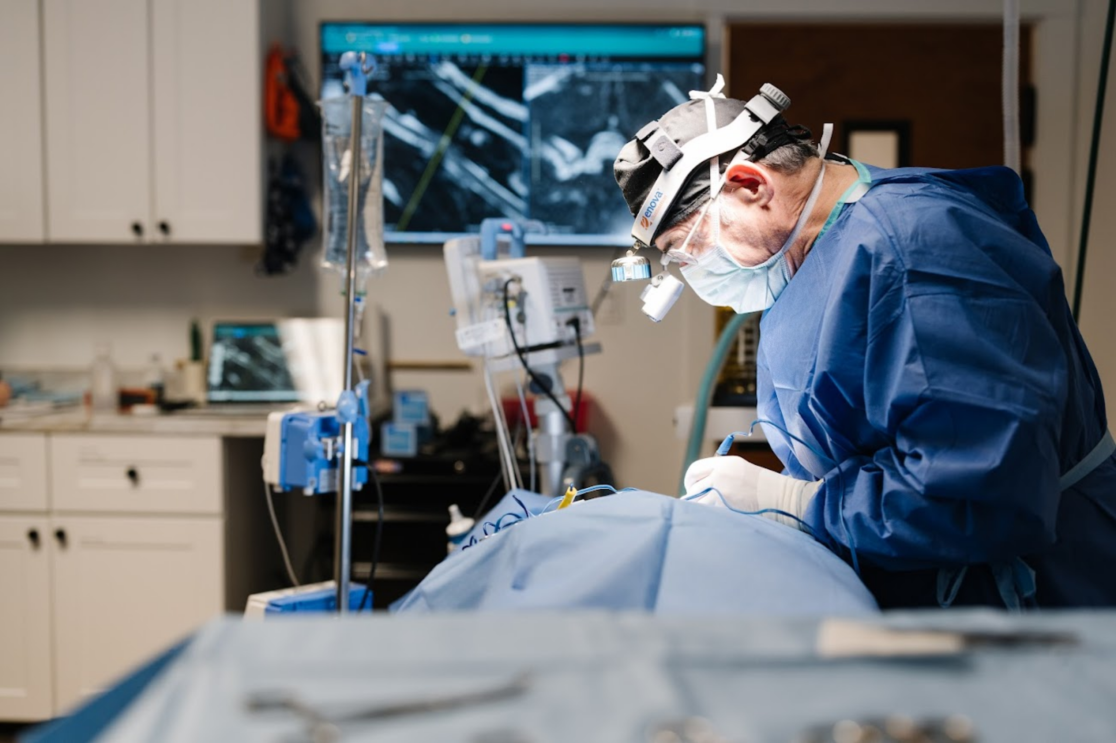 Veterinary surgeon performing a spinal procedure on a dog after advanced neurological imaging