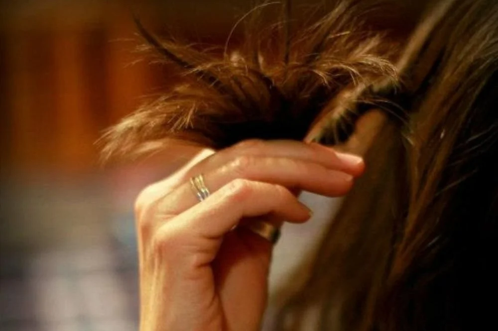Girl Twirling Hair Stressed Out