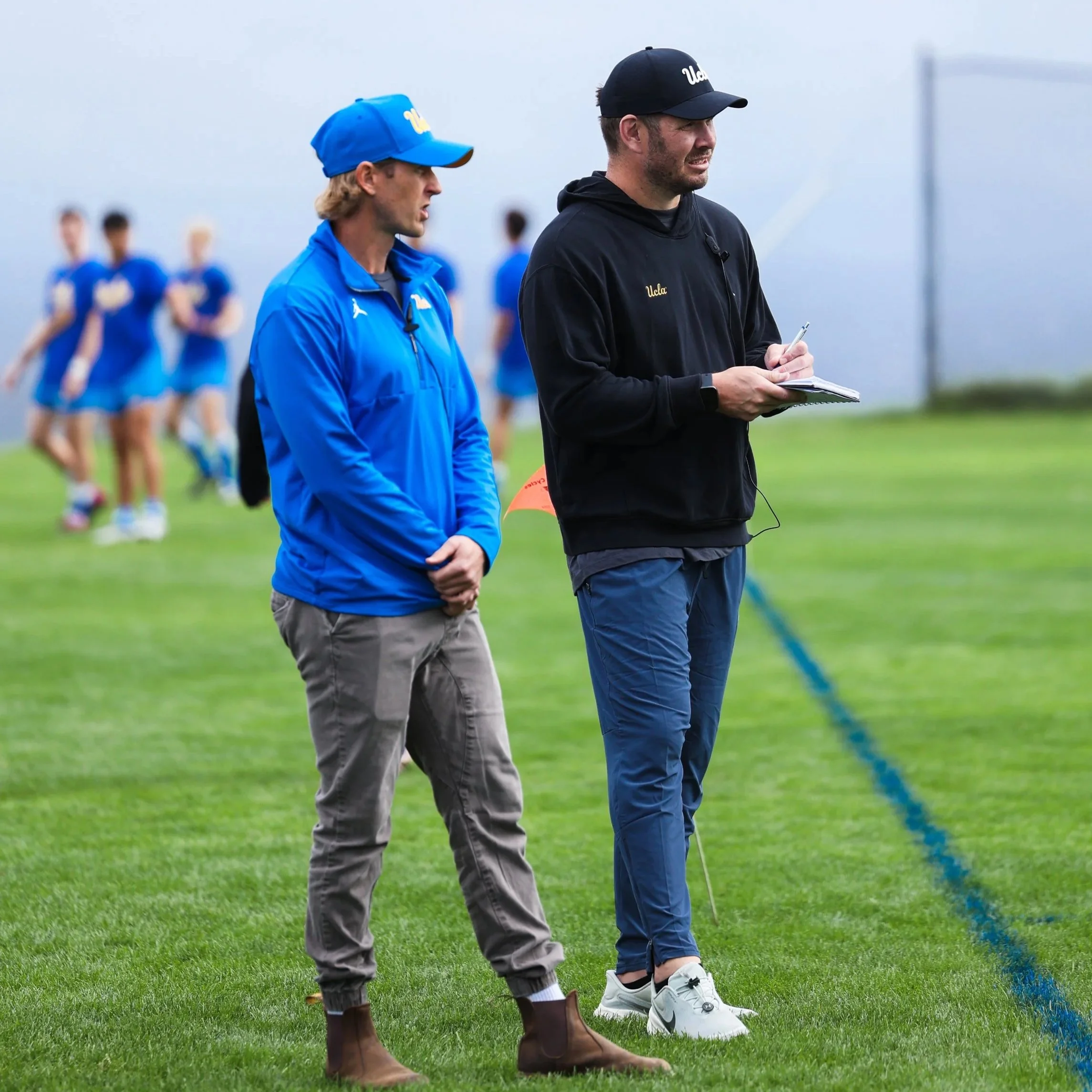 Geometric drawing of an outline square with sections divided by vertical, horizontal, and half circle lines.