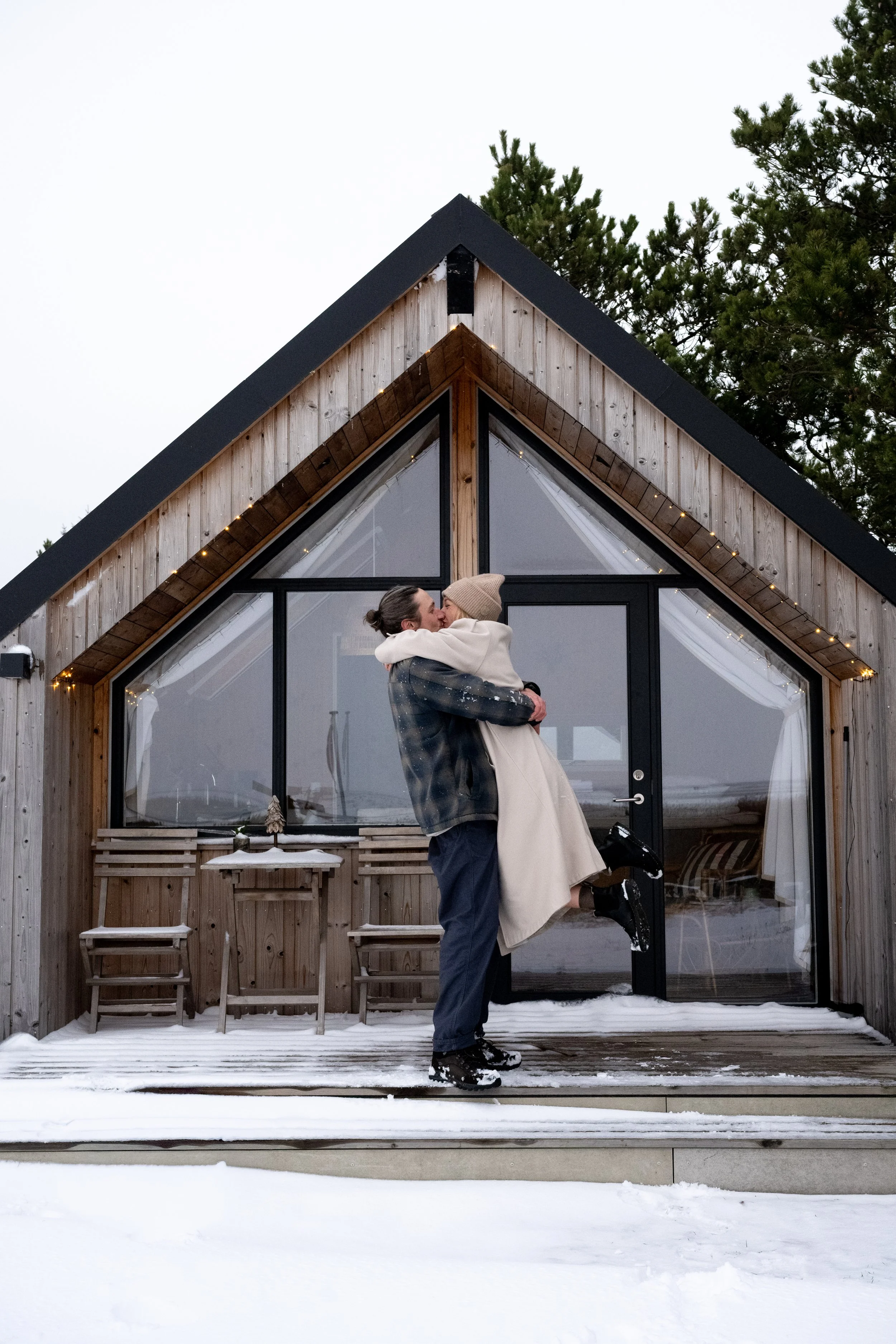 Bride and groom kissing outside