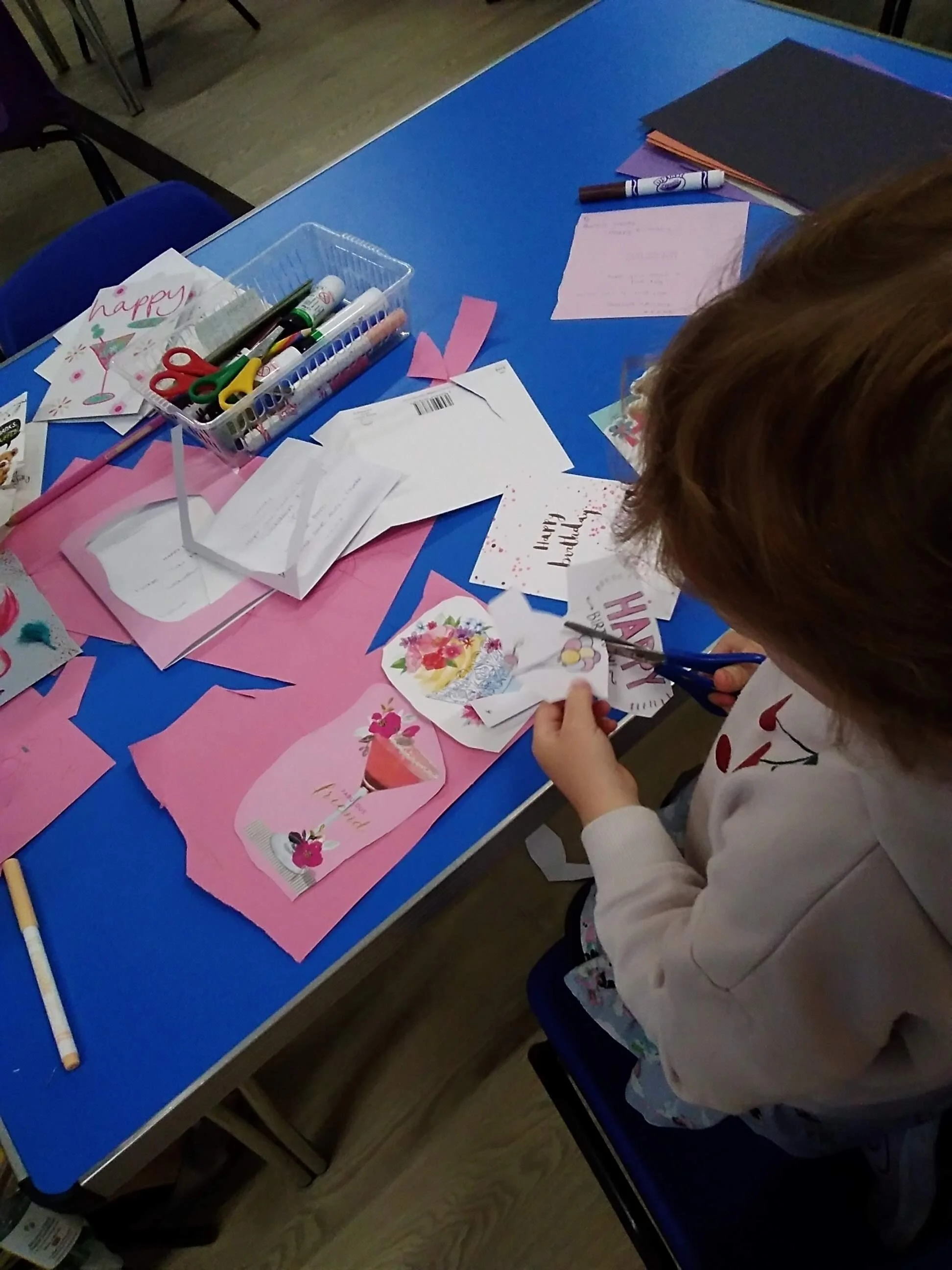 This little girl is showing her great scissor work. She has mastered cutting in straight lines and around different shapes. We have lots of different scissors (right handed, left handed, trainer scissors, pattern scissors etc)