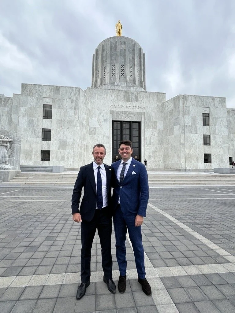 Anthony Kolanko and Adam Root in front of State of Oregon